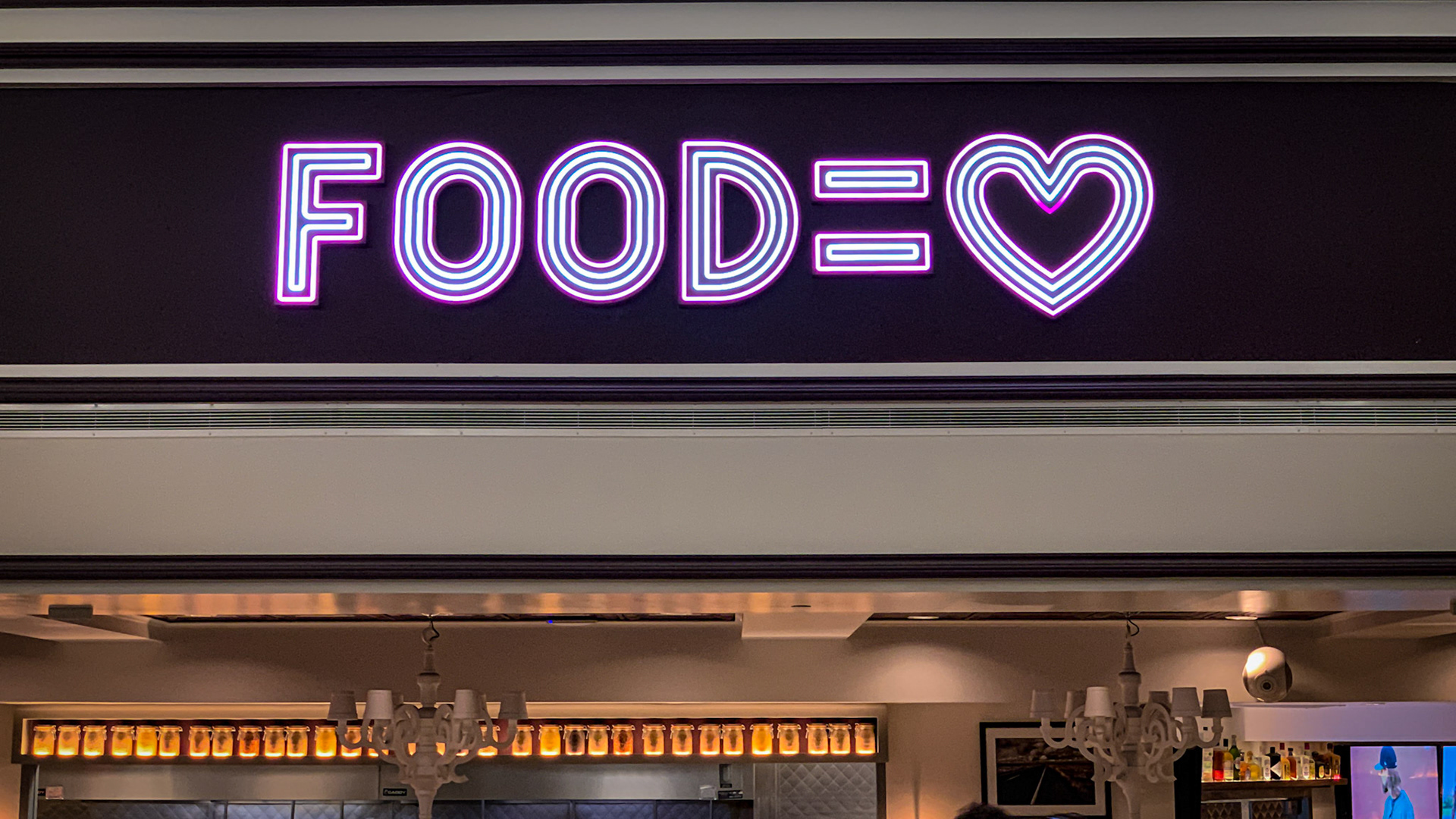 A feeding sign I saw at a restaurant in the Newark, NJ, airport.  And we wonder why we have an obesity epidemic (Food ≠ Love).