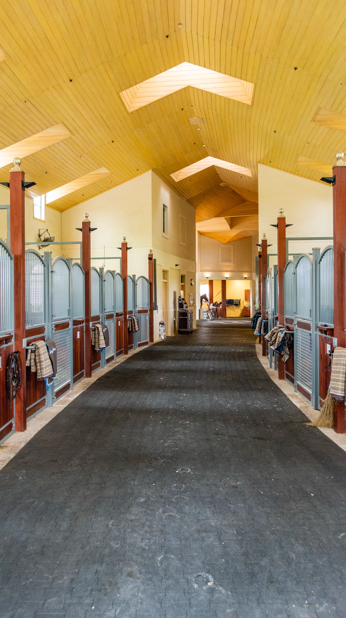 Rubber brick flooring and a finished stained wood ceiling.