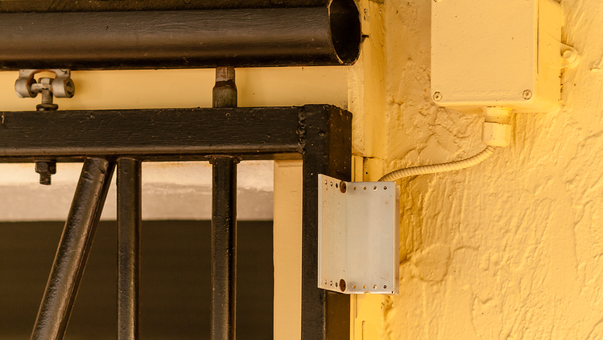 This closed stall door closes a sensor to indicate that the door is closed