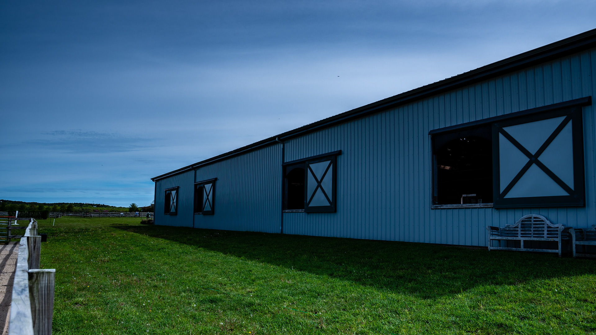 A Covered arena in NY with sliding covers over the side windows.