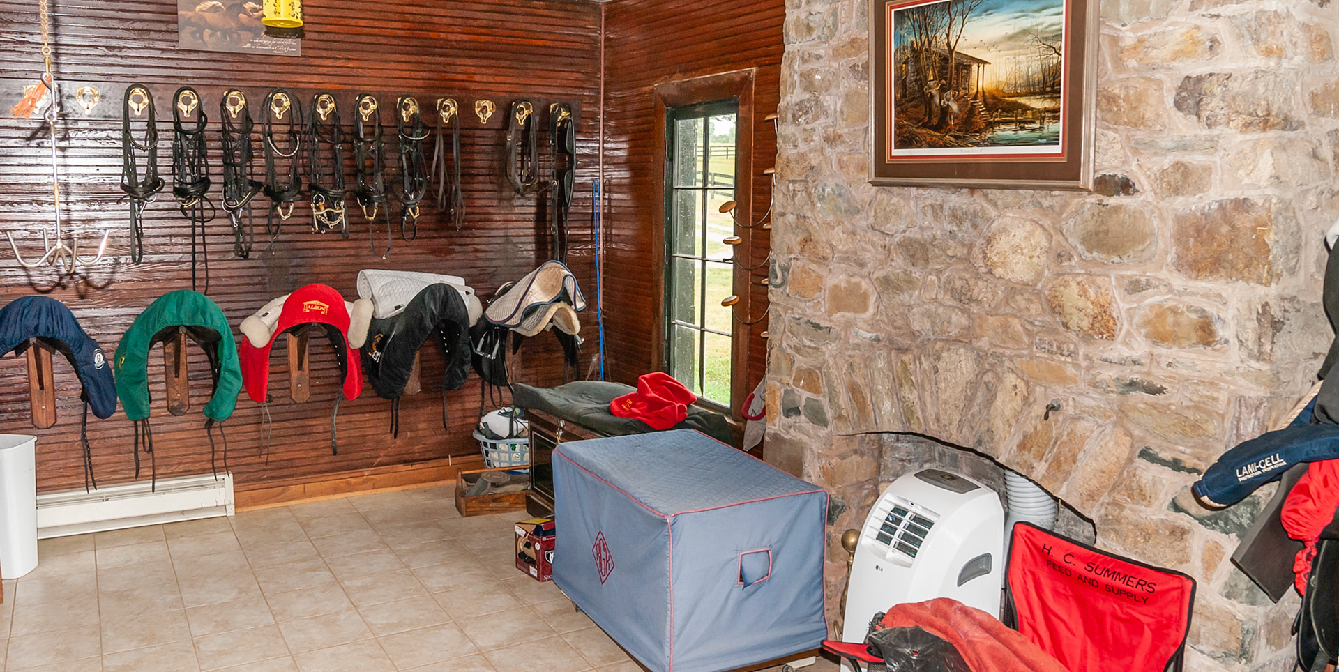 An electric heater installed into an old fireplace in this barn’s tack room.