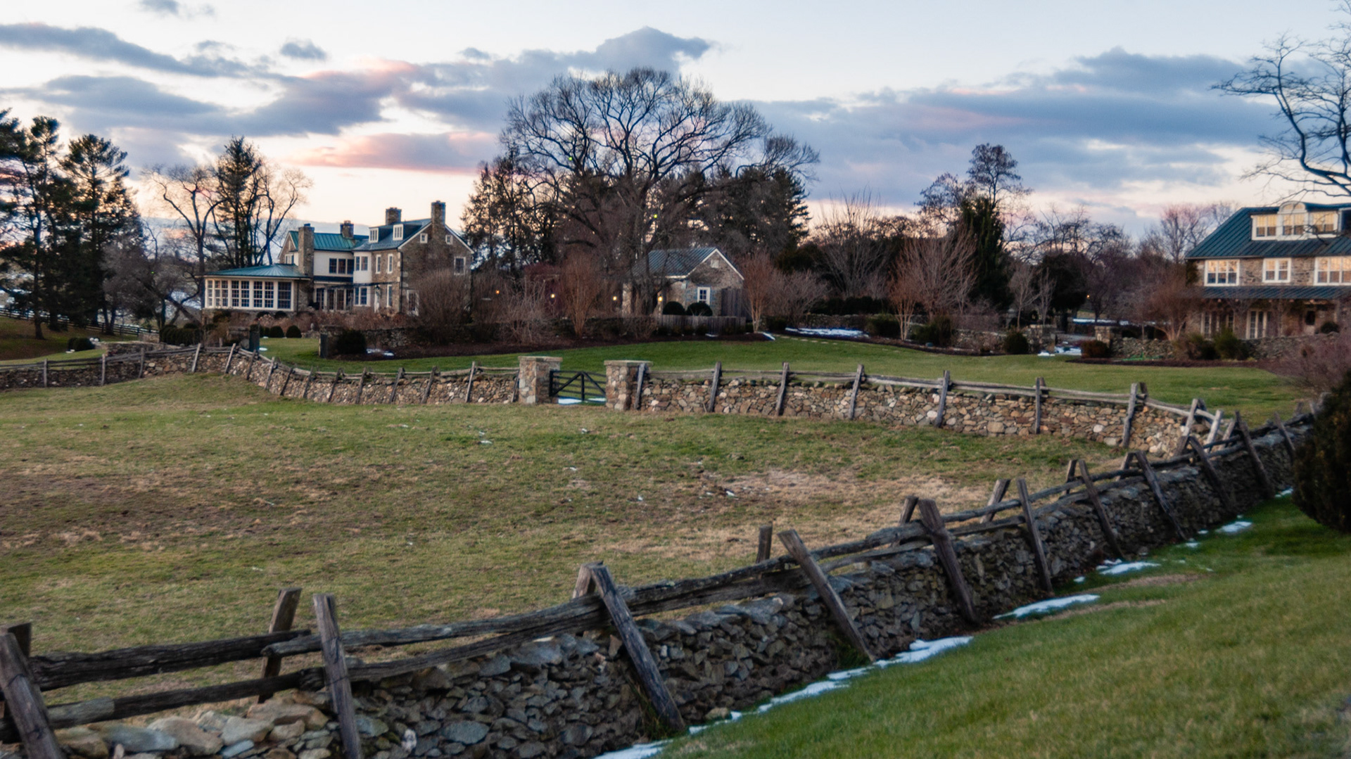 Winter dormant pasture. A traditional Virginia pasture fence made of stones with a top wooden section.