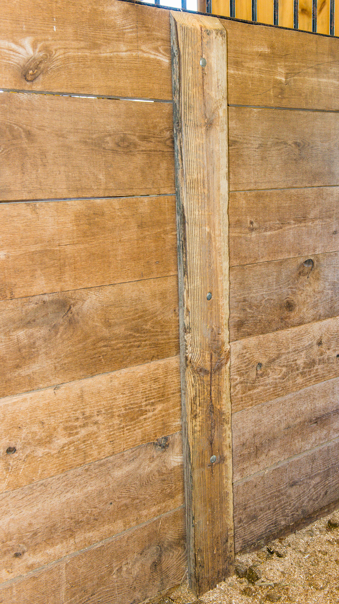 This sandwich board system has good details. The top edge is beveled.  Only 3 carriage bolts are used (good). The bolt heads are pressed into the wood.