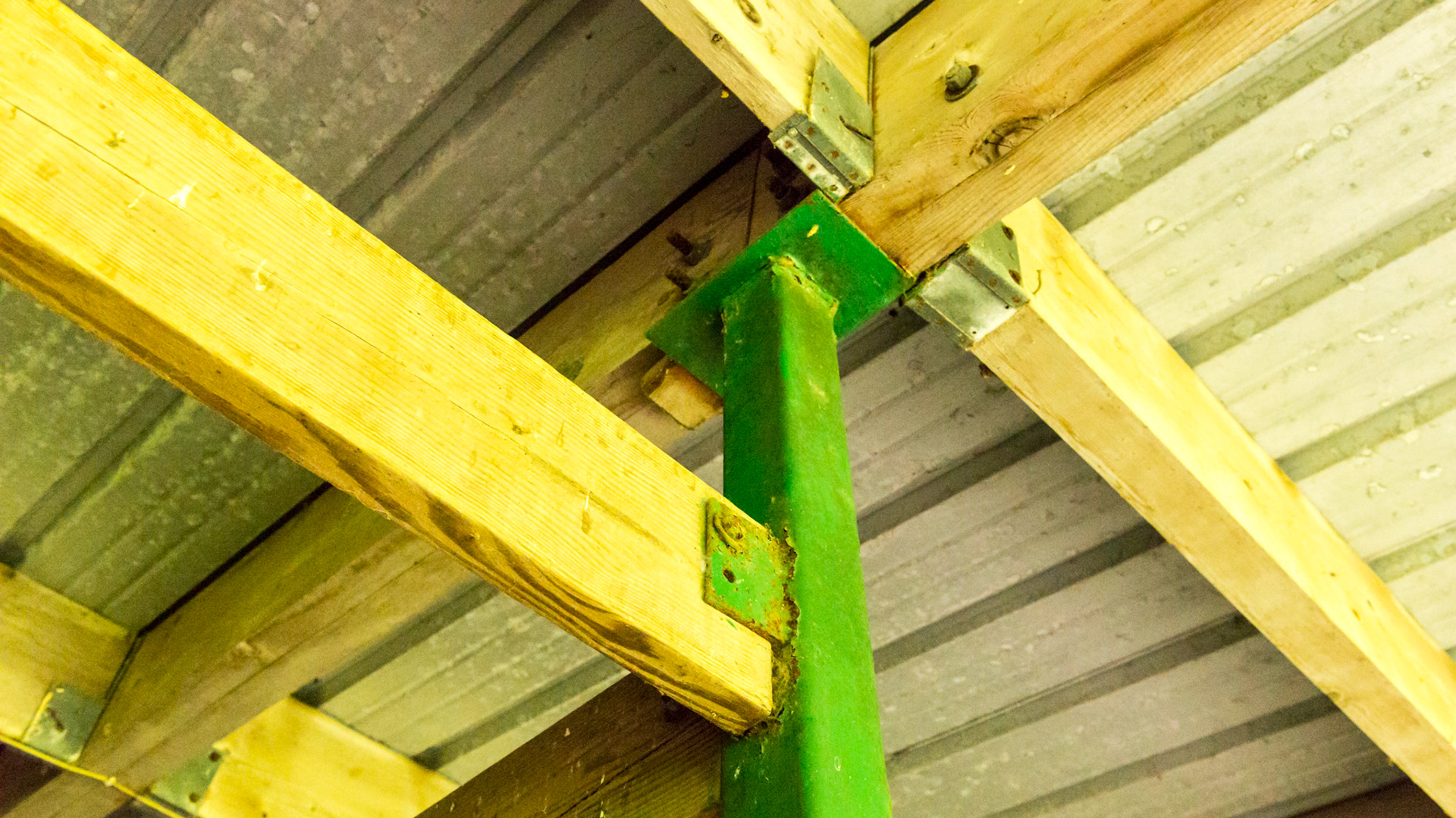 Steel poles set deeply in cement and bolted to the frameing beams allowed this barn to survive a Cat 5 hurricanr (Andrew).