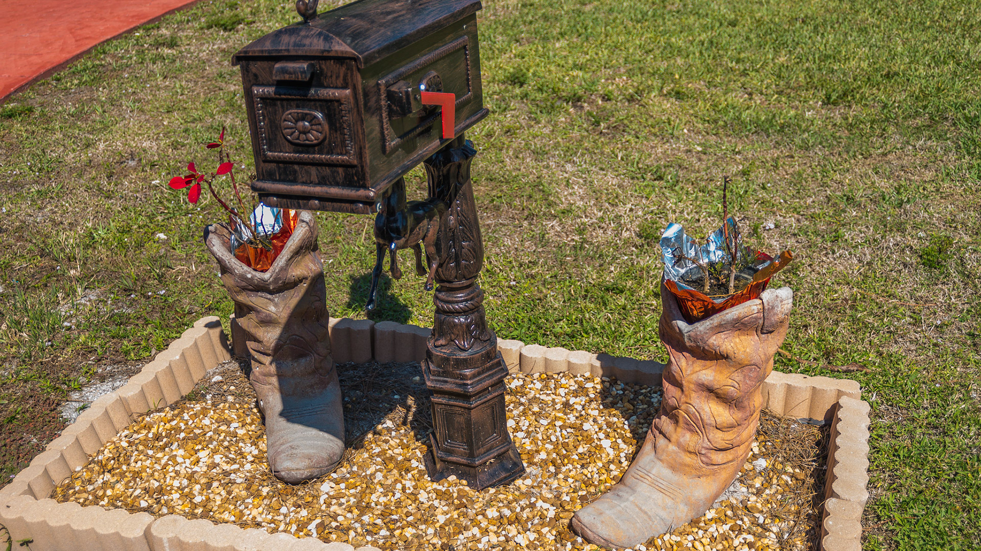 Boot flower pots around a mail box