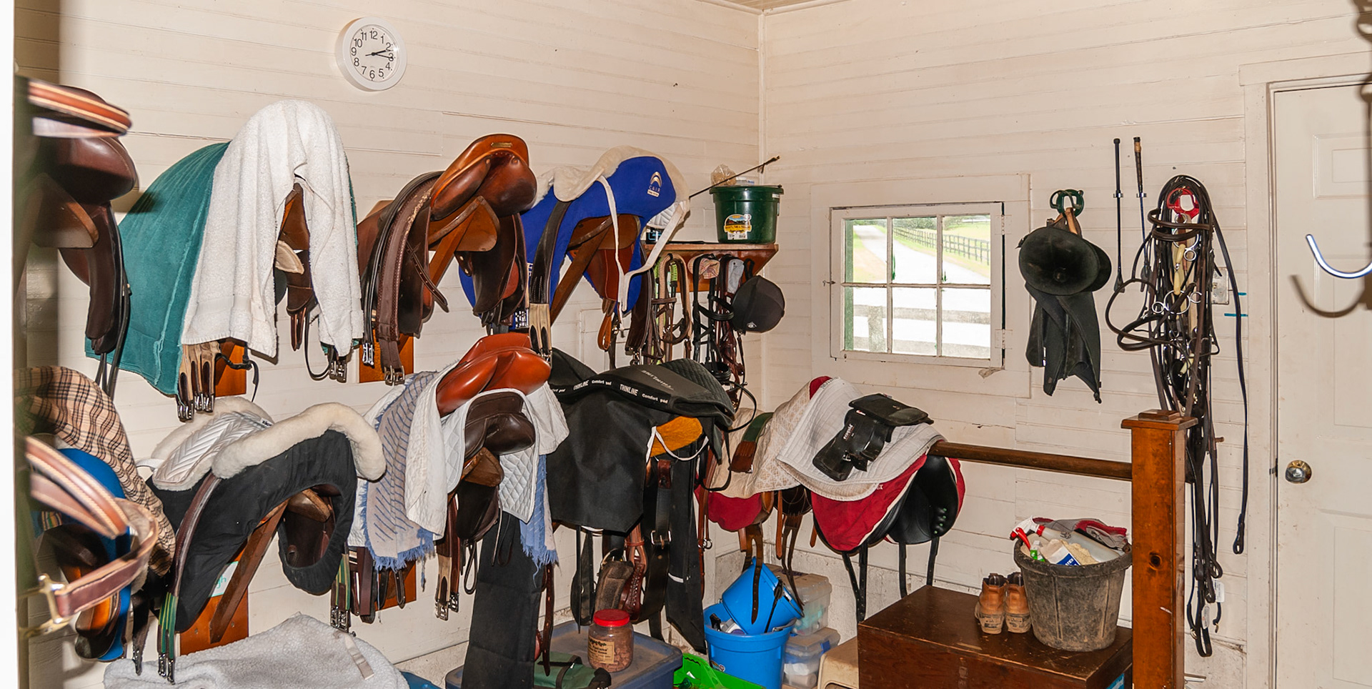 A disorganized tack room.