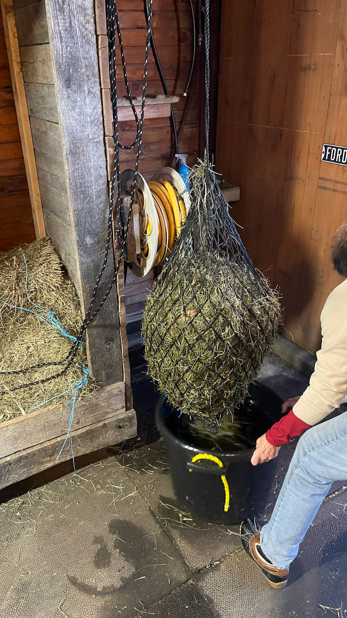 A rope winch system for raising and draining soaked hay.