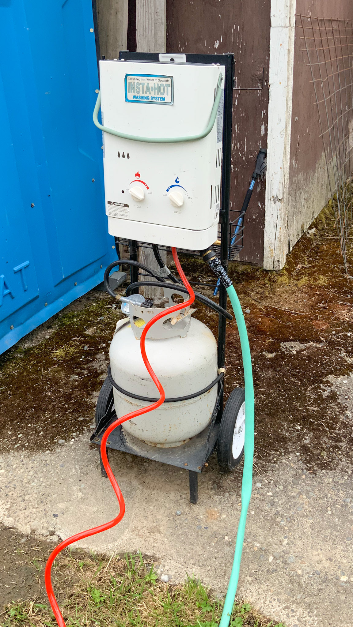 This is a propane driven instant hot water system next to the wash area.  The system is taken down during winter due to freezing of the lines.