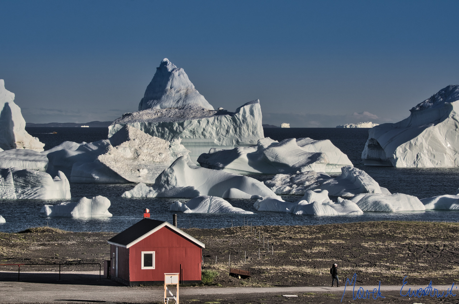 Global climate warming is amplified in the Arctic. One of the most visible results is glacier retreat and an associated increase in calving rates. Icebergs, Disko Bay, Greenland.