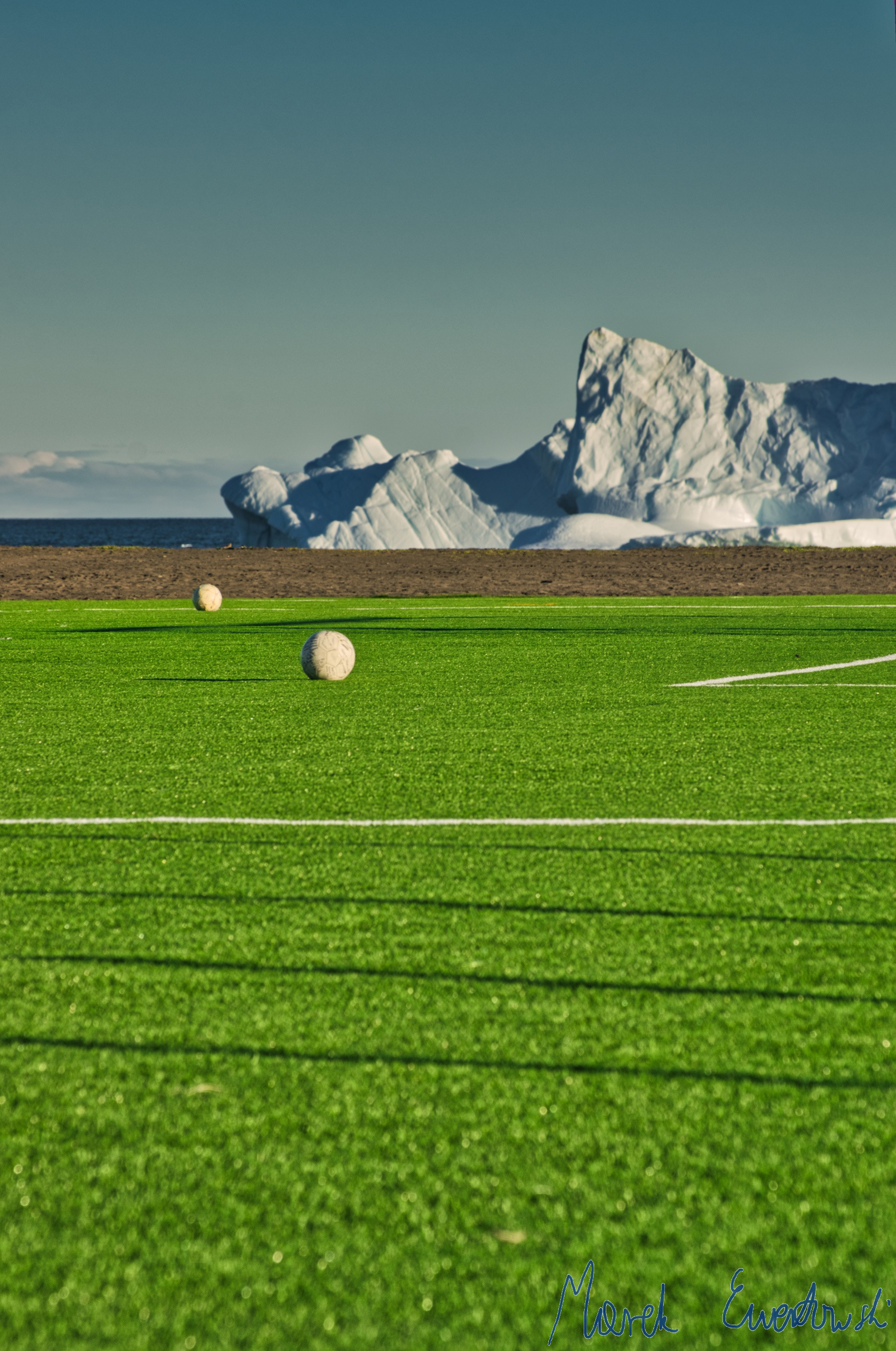 The football season inside Arctic Circle is short, but still, football is a trendy sport in Greenland. Football pitch, Qeqertarsuaq, Greenland.