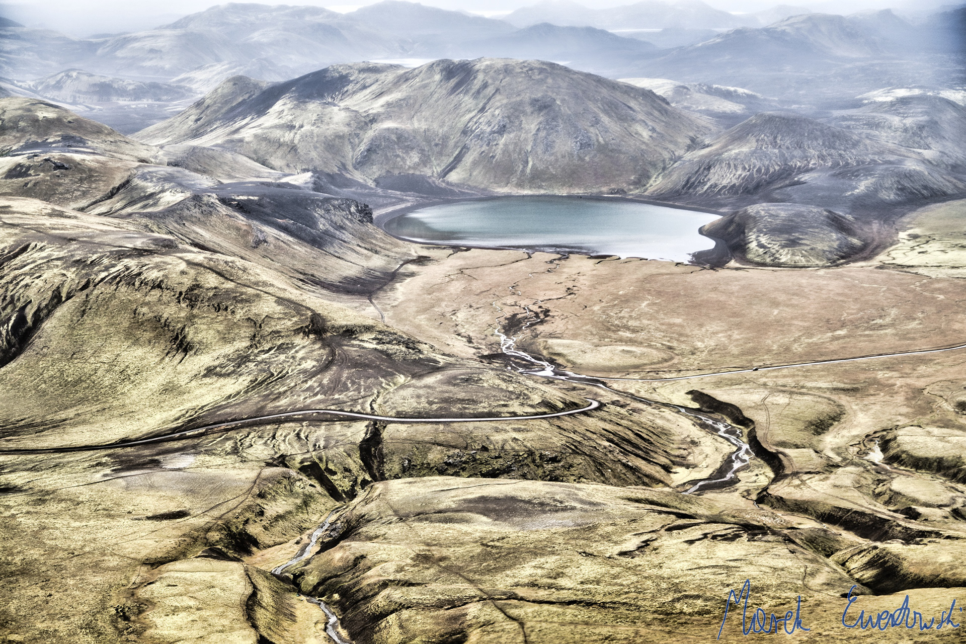 Icelandic interior is often foggy and mesmerized, offering spectacular views of glacial lakes and extinct volcanos. Dómadalsvatn, Iceland.
