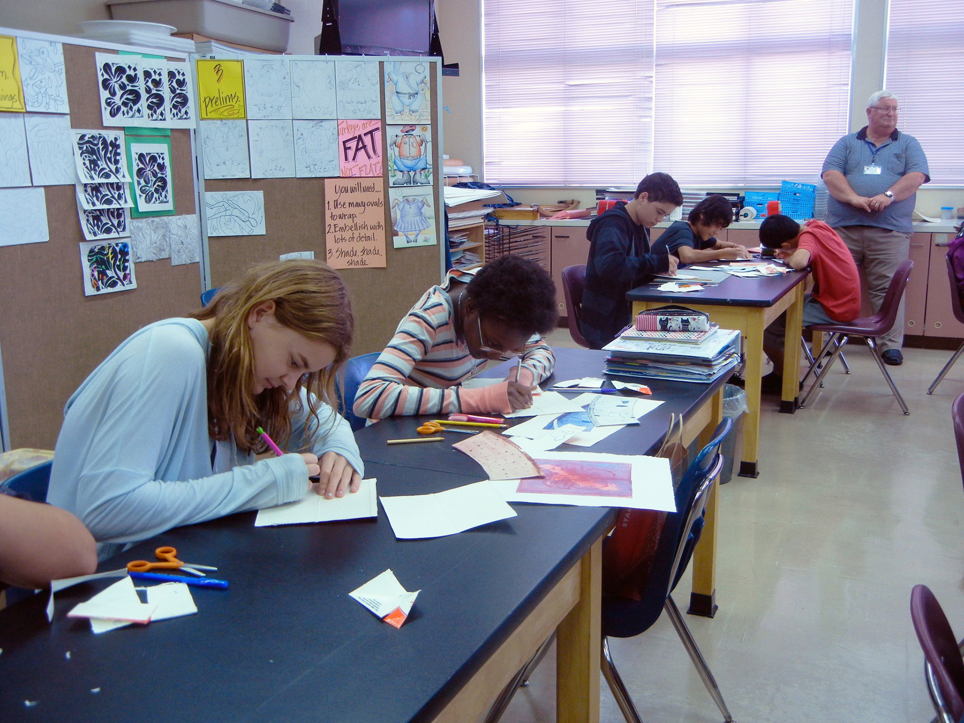 Lester Middle School, Okinawa in Japan. The students are creating milk carton drypoint plates.