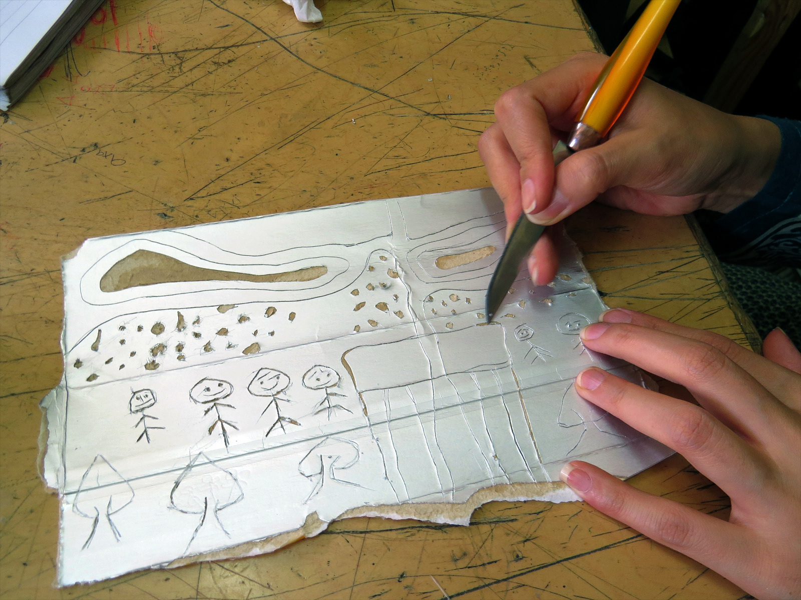 Creating a milk carton drypoint plate.