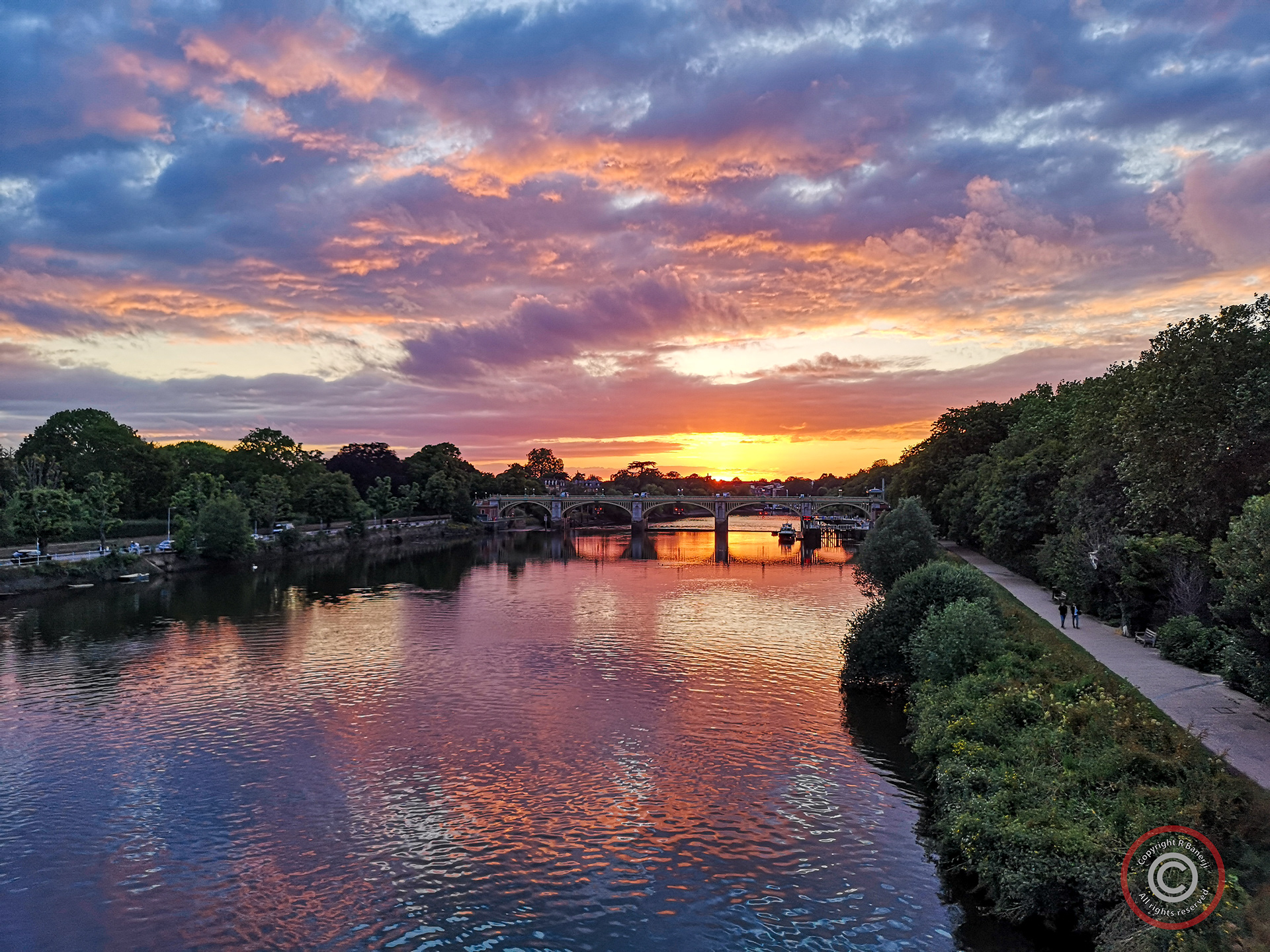 A fiery sunset over Richmond Lock and Weir, London