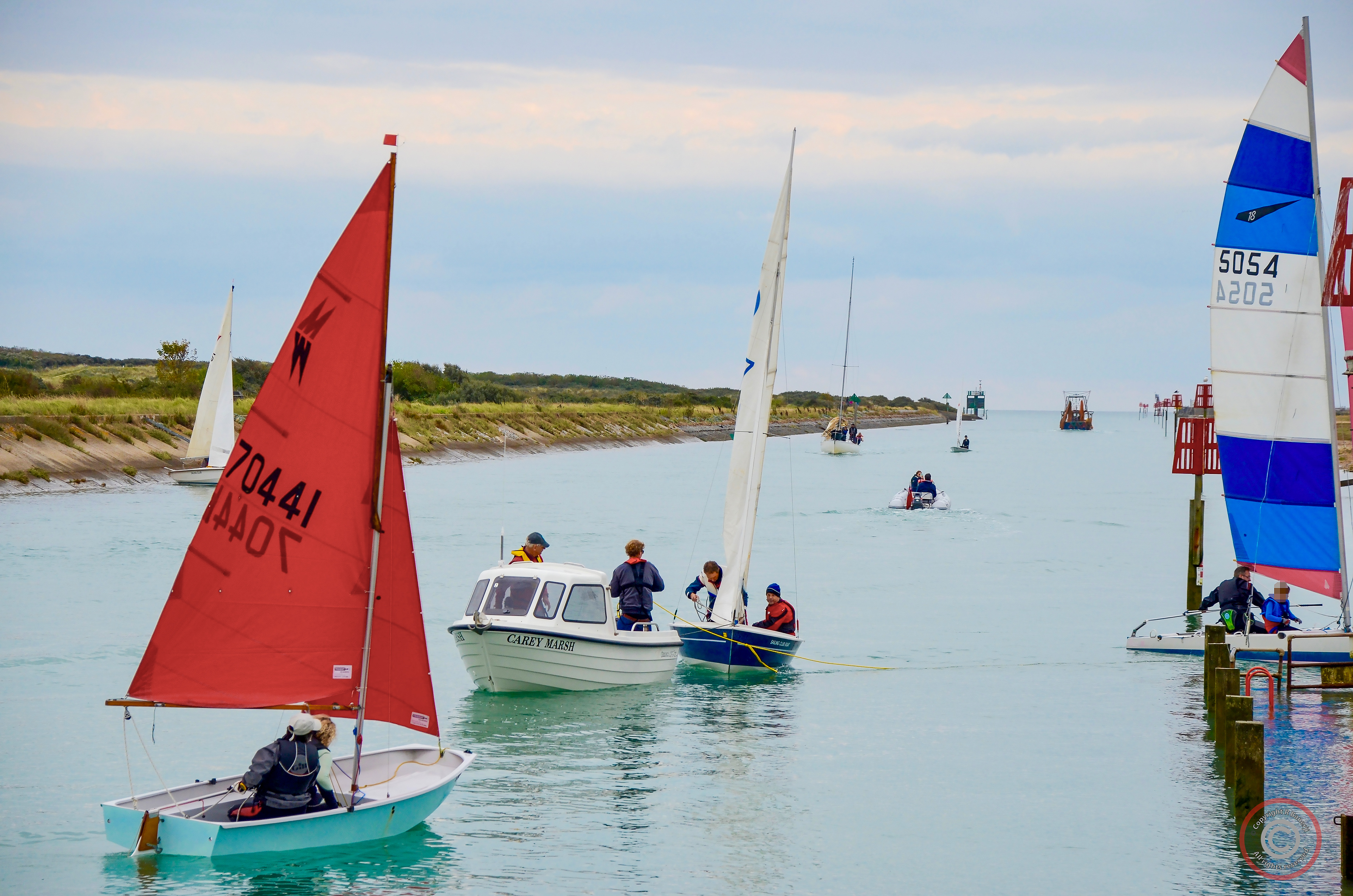 Sailing boats come into harbour, Rye, England