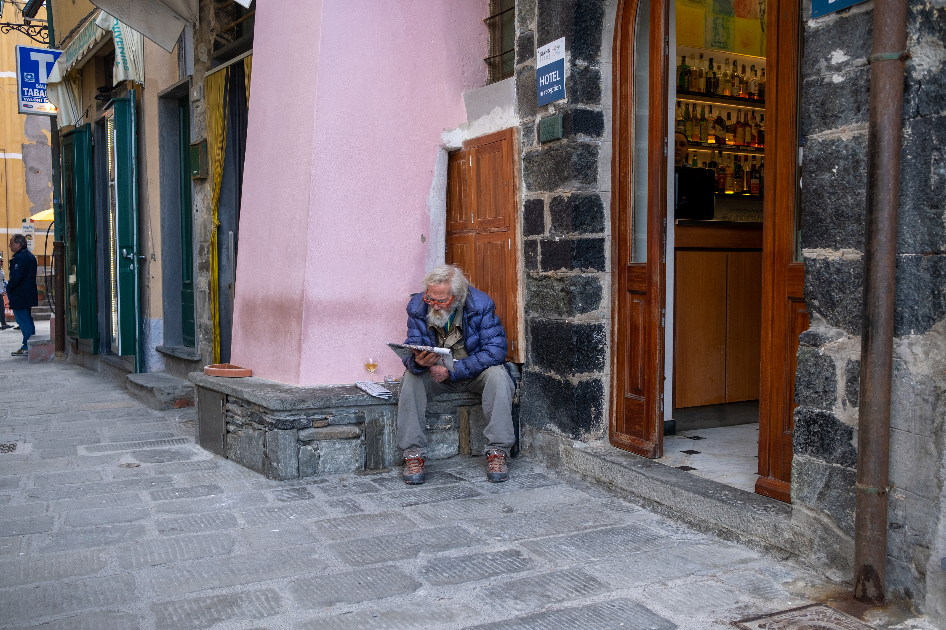 Reading the news, Vernazza, Italy