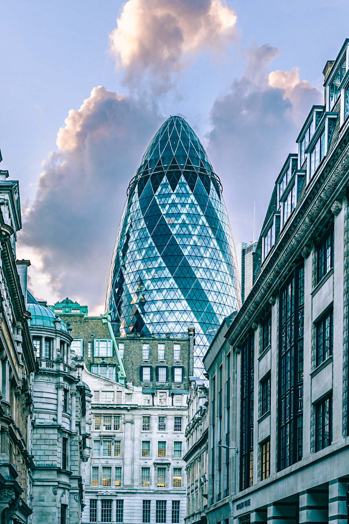 Gherkin: A view of the Gherkin building from the City of London streets. Portrait. Colour. Printed on Hahnemühle FABSatin