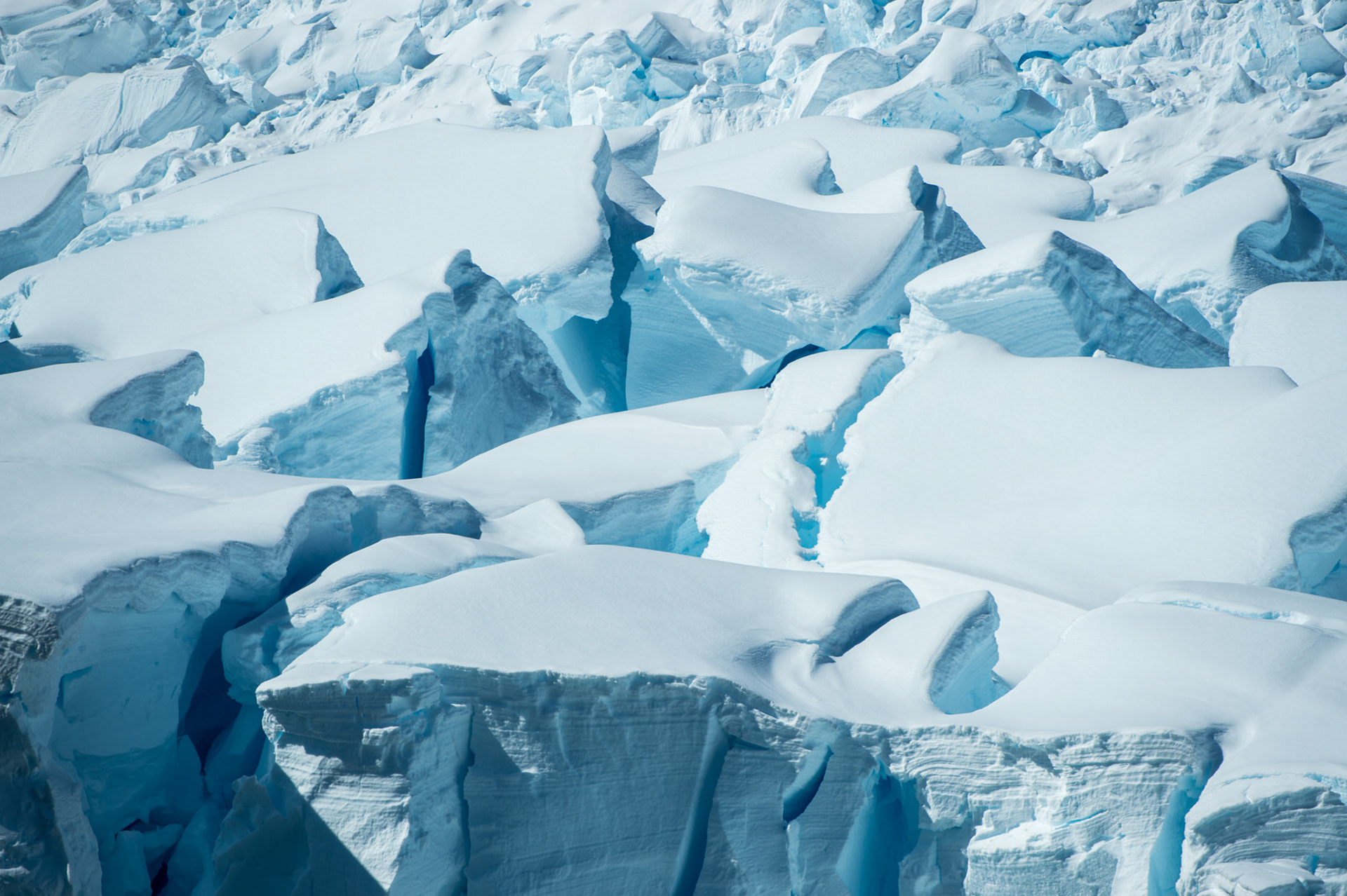 Chunky snow covered glaciers near Paradise Harbor, Antarctica