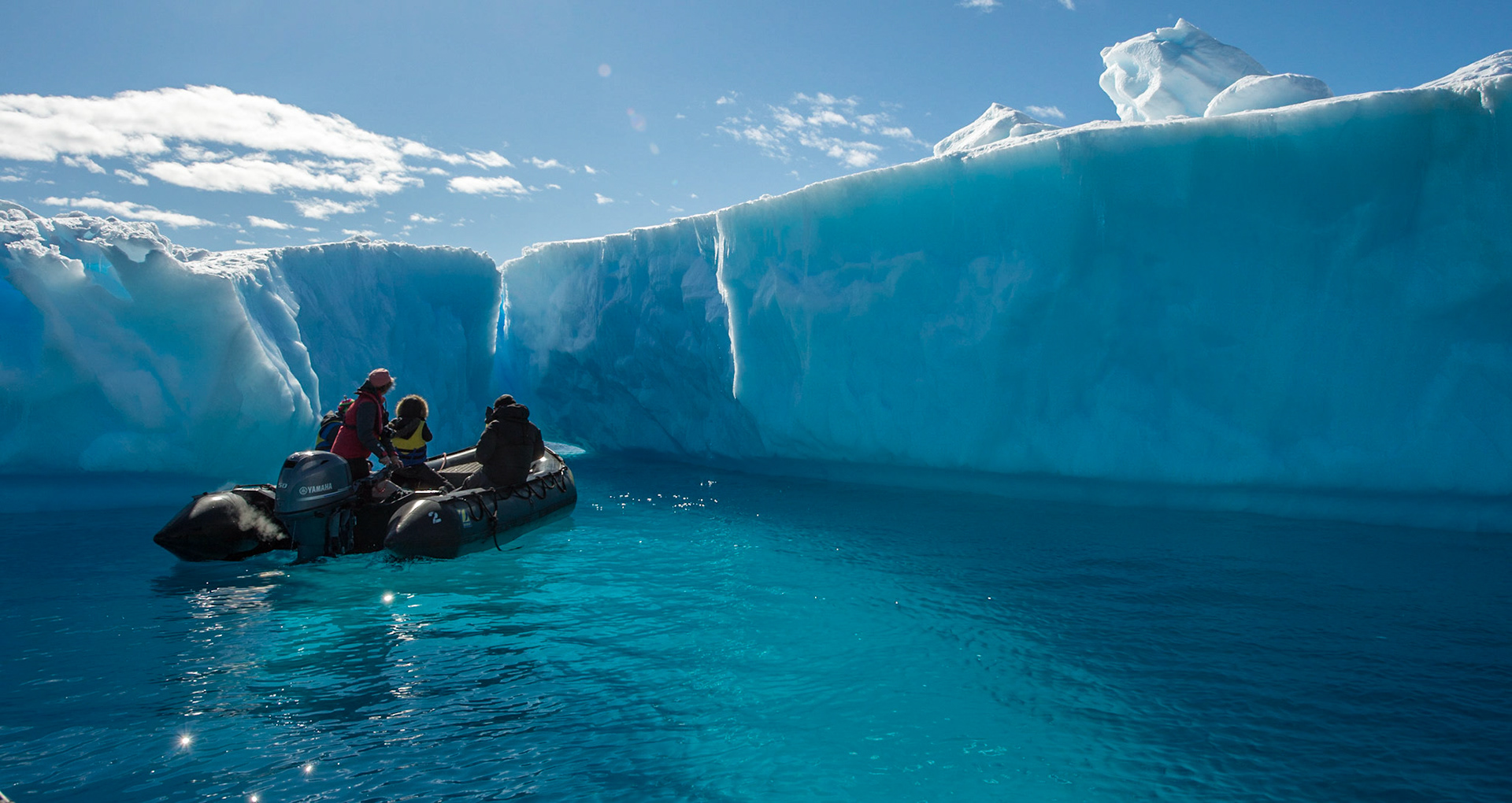Zodiac near an iceberg, near Astrolabe Island, Antarctica