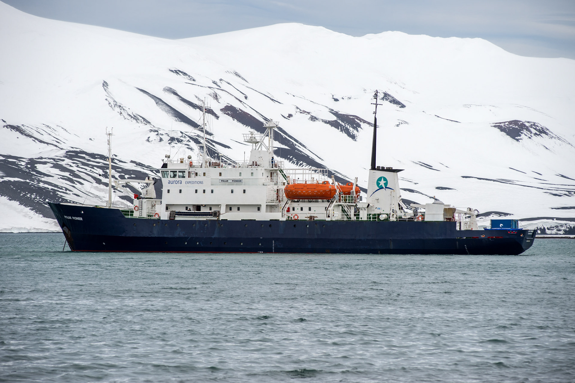 The expedition vessel Polar Pioneer, anchored in Whaler's Bay in Deception Island near Antarctica.