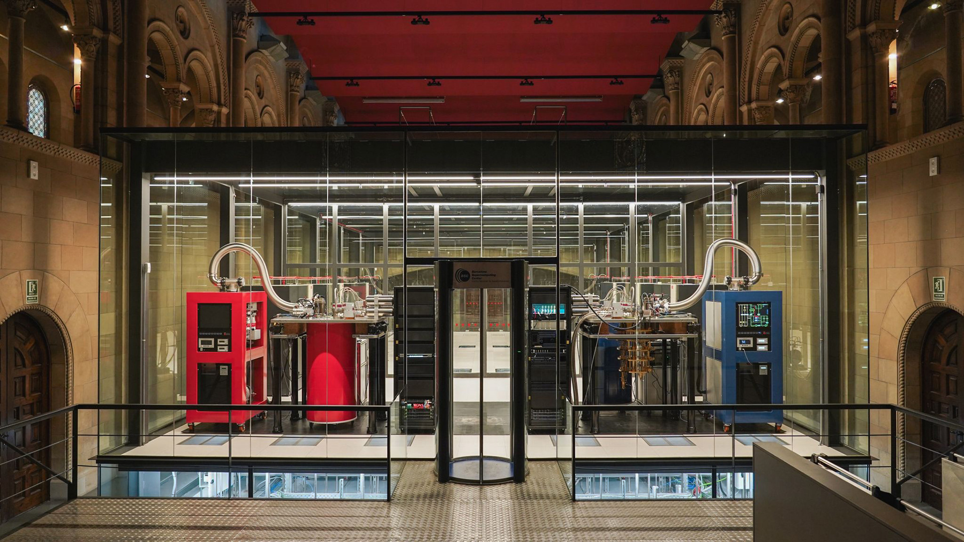 Barcelona Supercomputing Center (BSC-CNS) quantum system of cryogenic dilution fridges and a recognizable mounted Qblox Cluster control stack.
