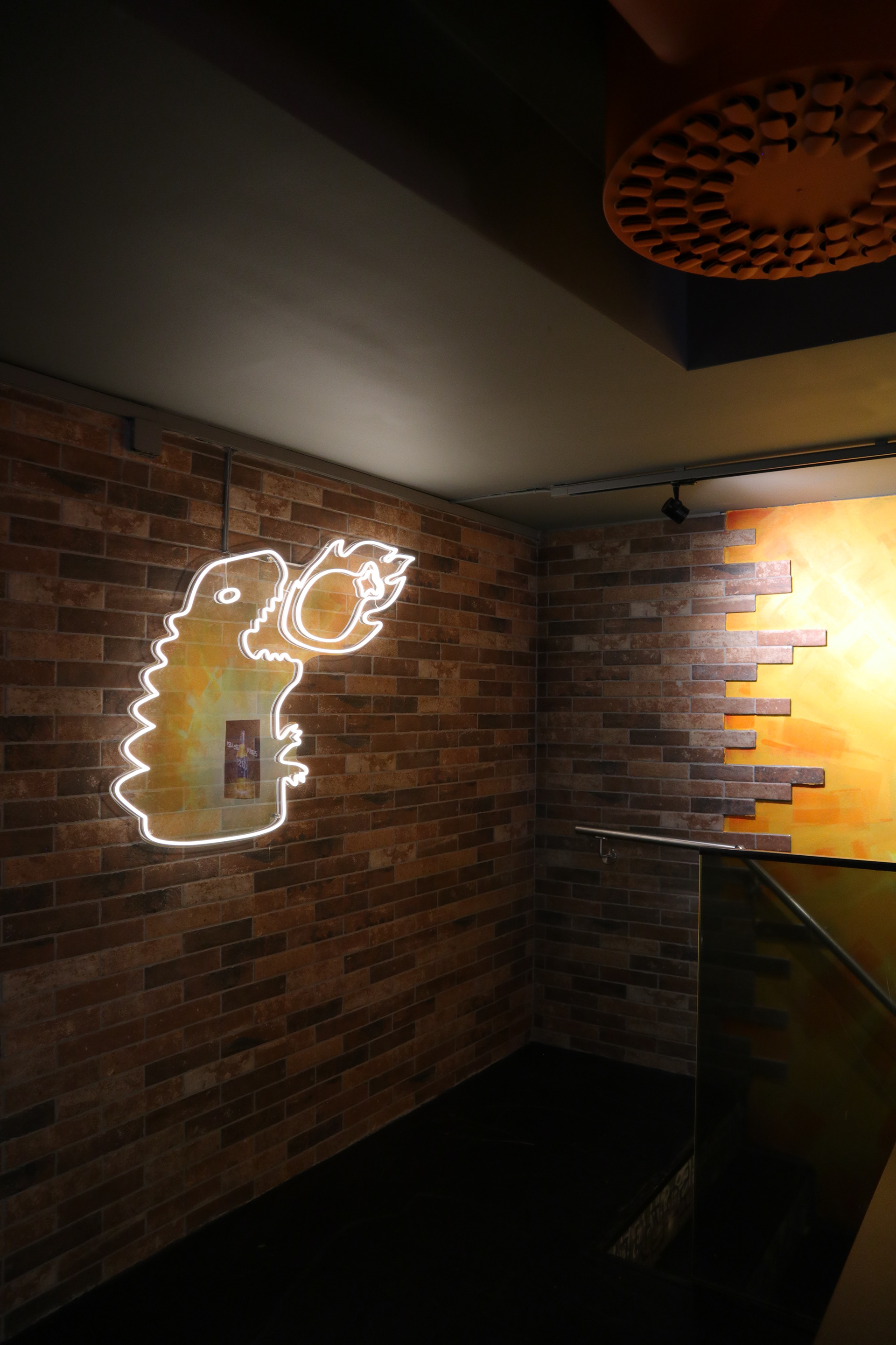 Monster Chicken's logo in LED when customers to go upstairs