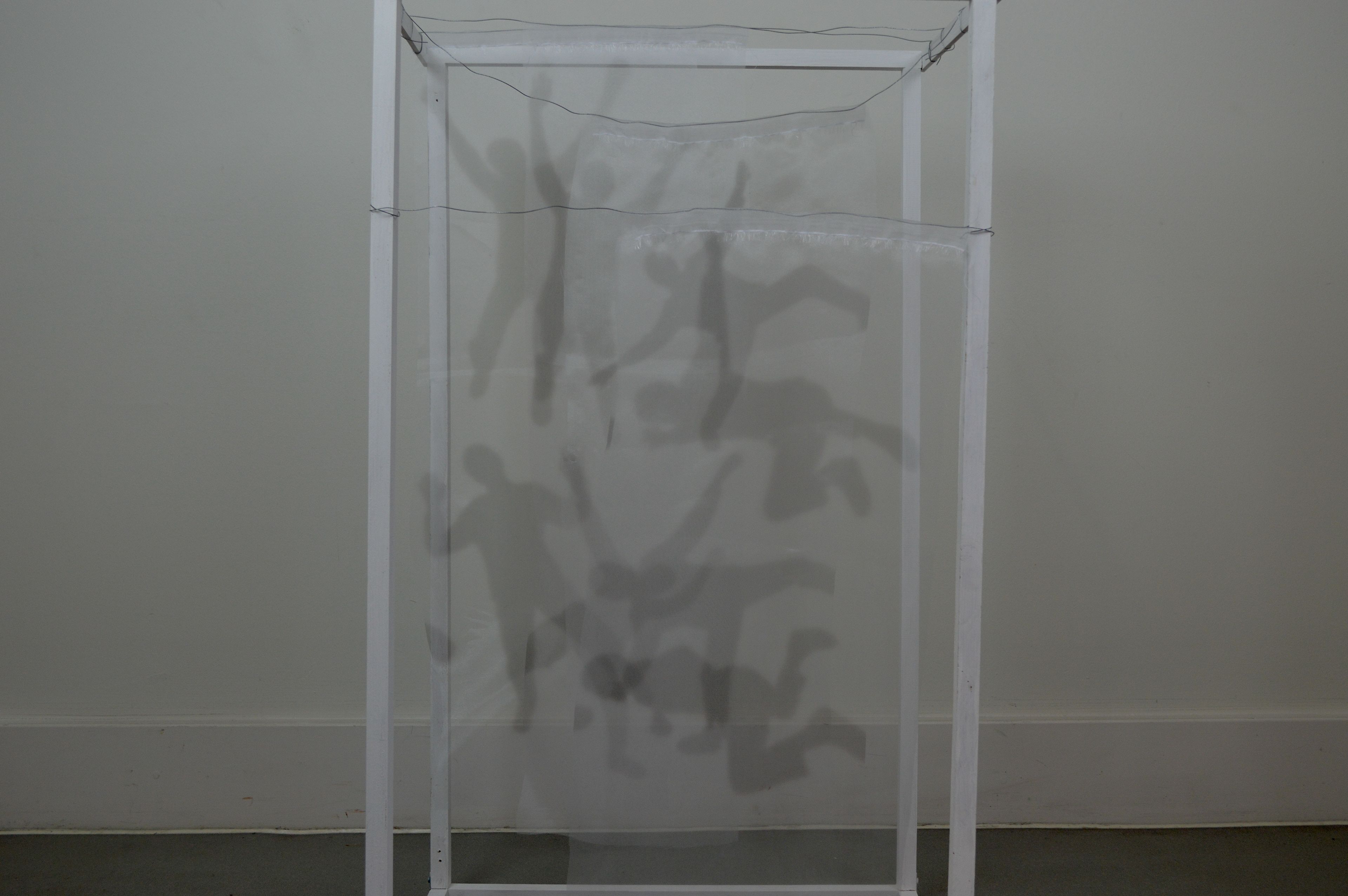 Chiffon Sculpture - Falling, Front view. A sculpture comprised of ink printing on chiffon, hung on wire in a box sculpture