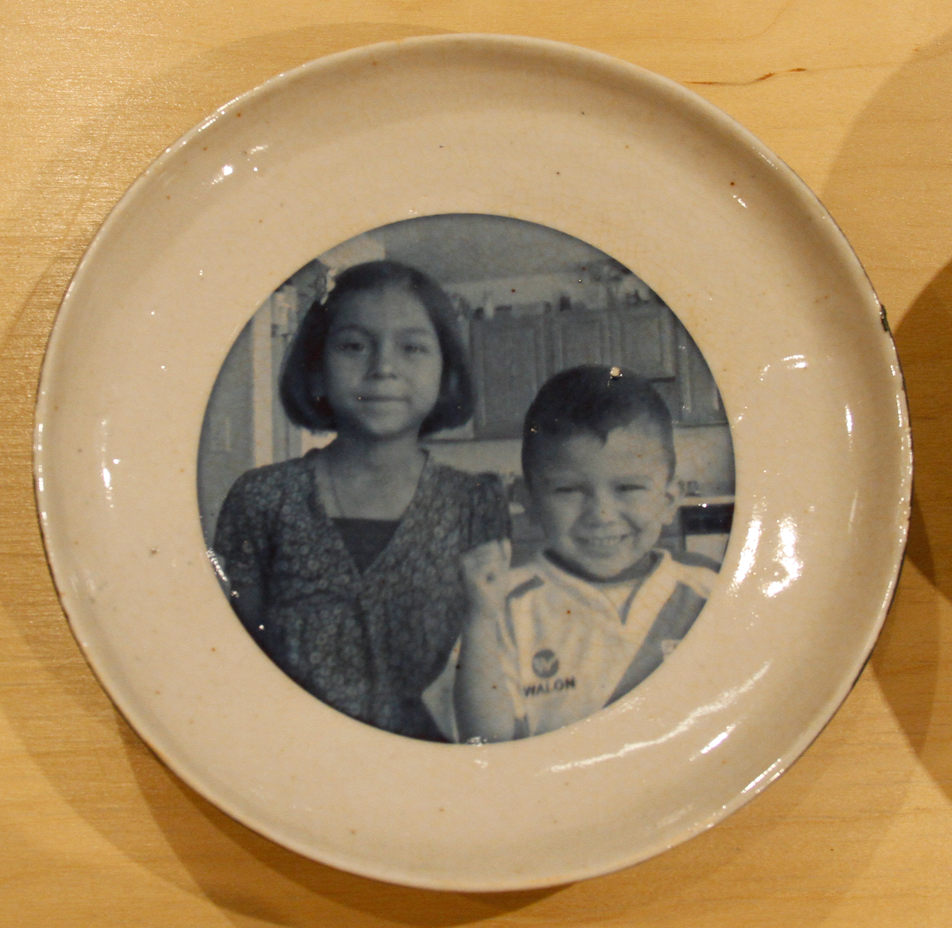 Sam & Kai plate, from "It Takes a Village", 2023, porcelain 
