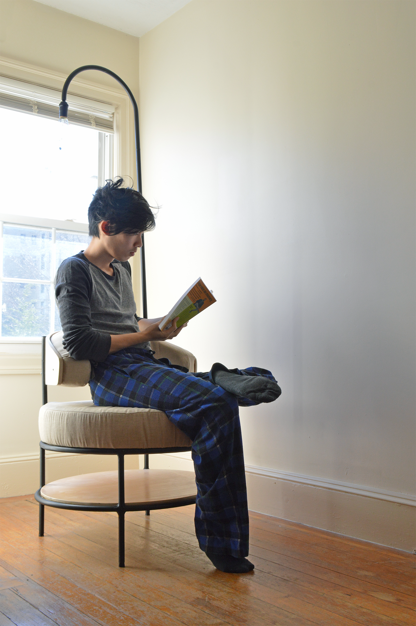 Shelf at the bottom makes it for the perfect reading chair