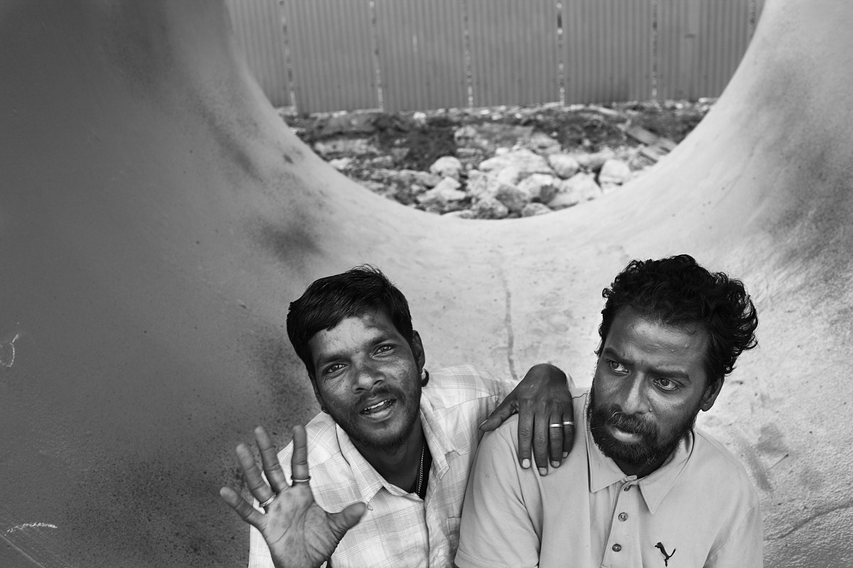 Arul Francis, with his friend Selva who was quite drunk, mirroring the choice of many men who find themselves at loose ends without a home or a job. While Selva attempts to get back to his family Arul, a former electrician only has partial use of his left arm and leg after a stroke. He is now unemployed. His mother has a serious case of Diabetic Foot