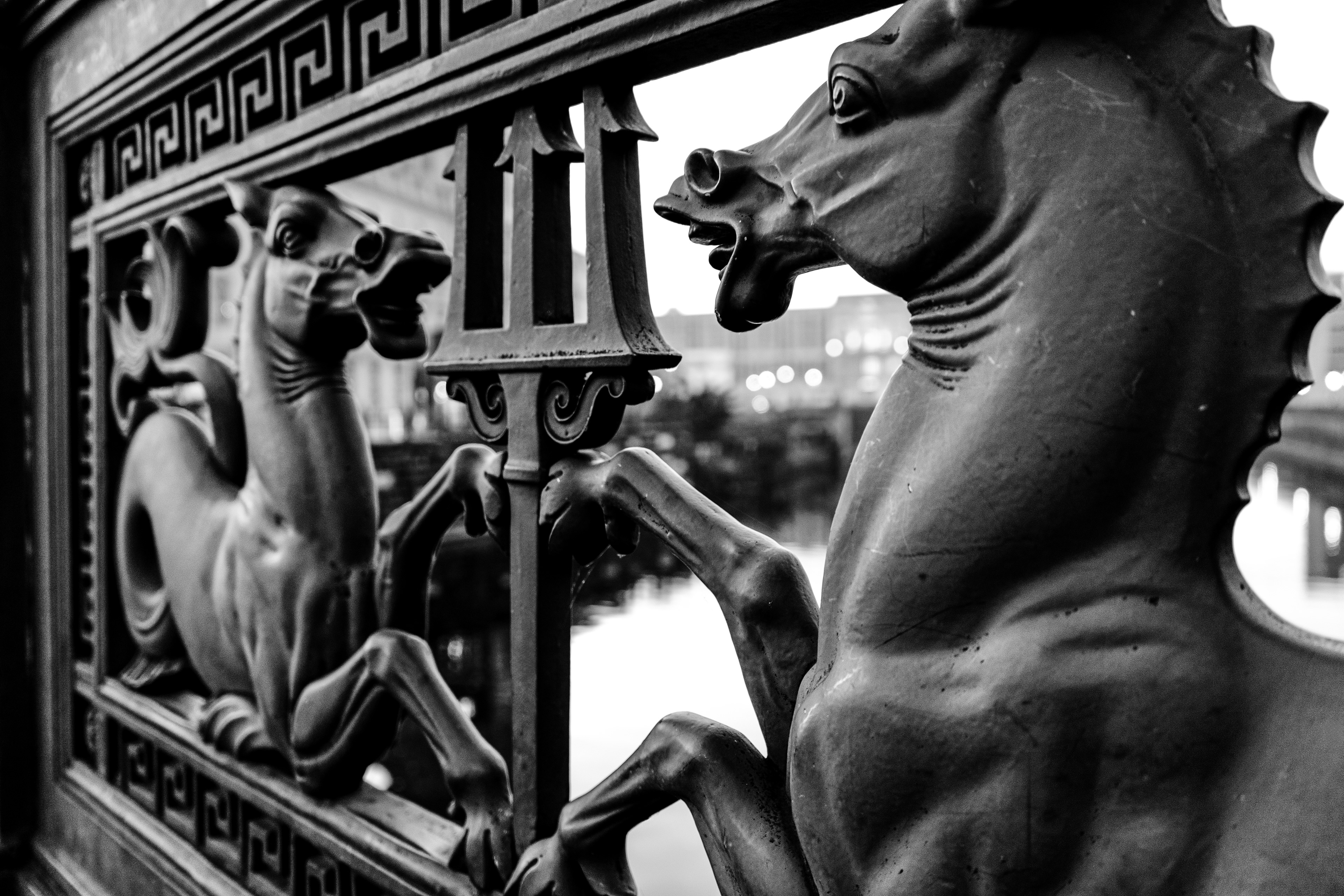 Black and white image of a wrought iron horse sculpture on the Spree River Bridge, Unter den Linden, Berlin, Germany