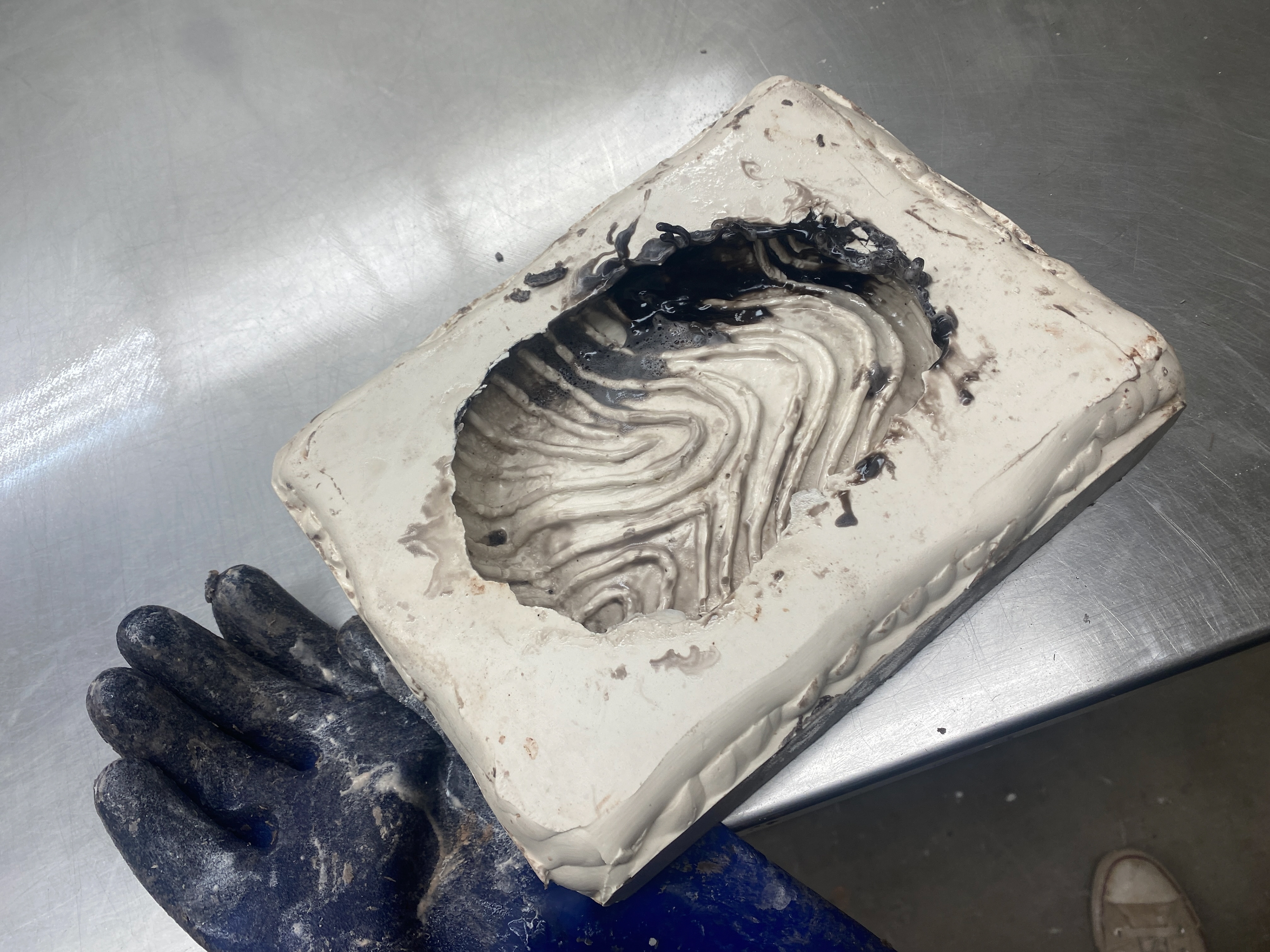 Removing wax from the plaster mold