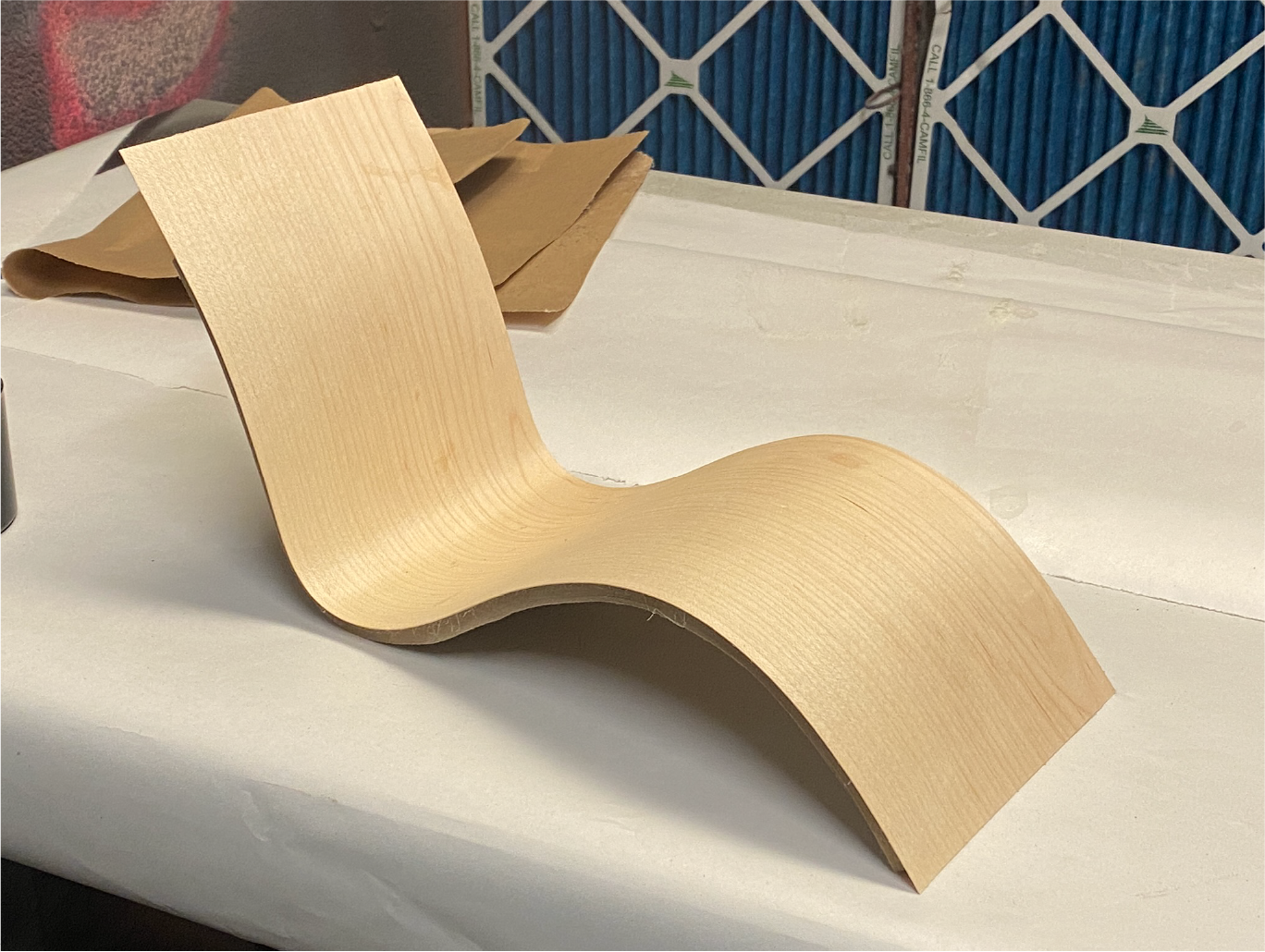 Maple veneer was applied with contact cement.