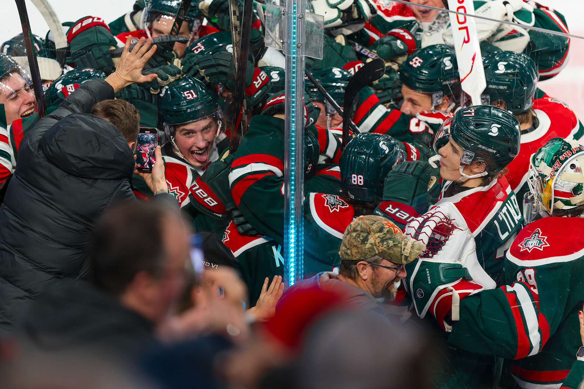 Halifax, Nova Scotia – Eddy Doyle (#51) of The Halifax Mooseheads celebrates his overtime winning goal against the Saint John Sea Dogs at Scotia Bank Centre on December 18th, 2025. Doyle scores in OT, then celebrates with teammates as a fan records the moment on their phone during the post-goal chaos.