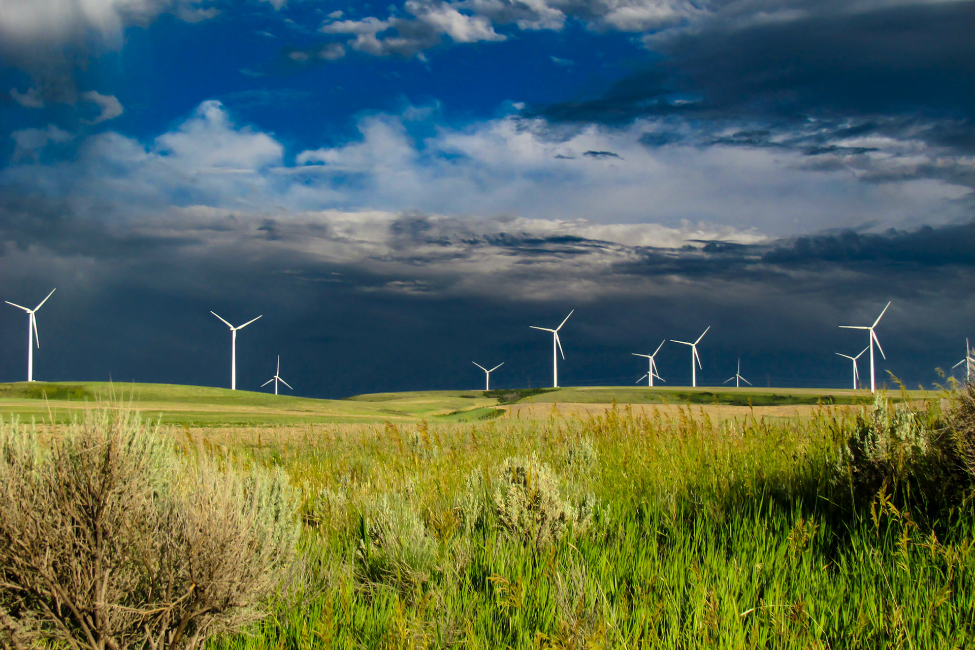 Storm clouds forming over foothills and windmills, Ammon, ID