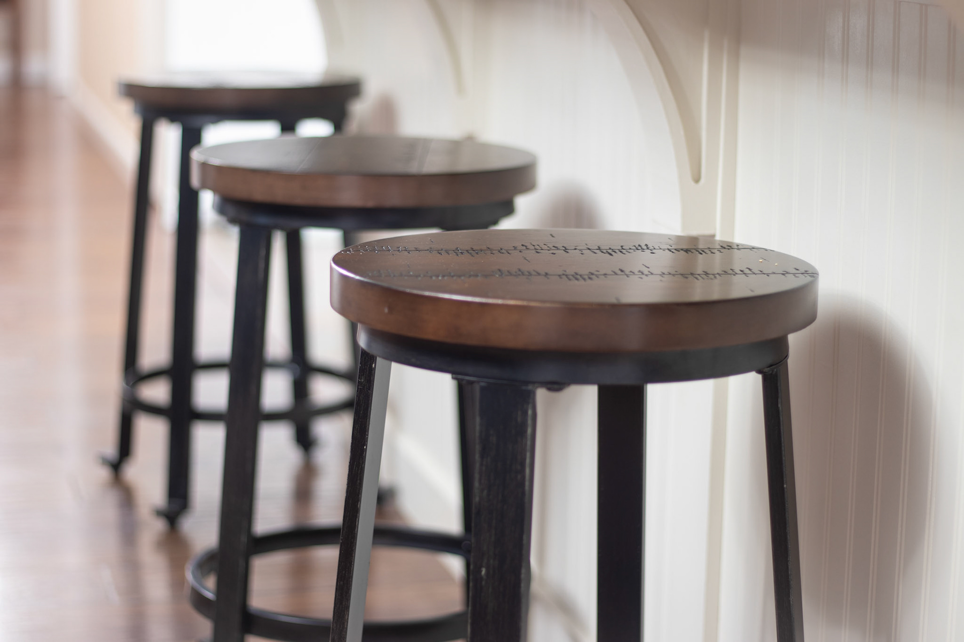 Hard barstools in soft light