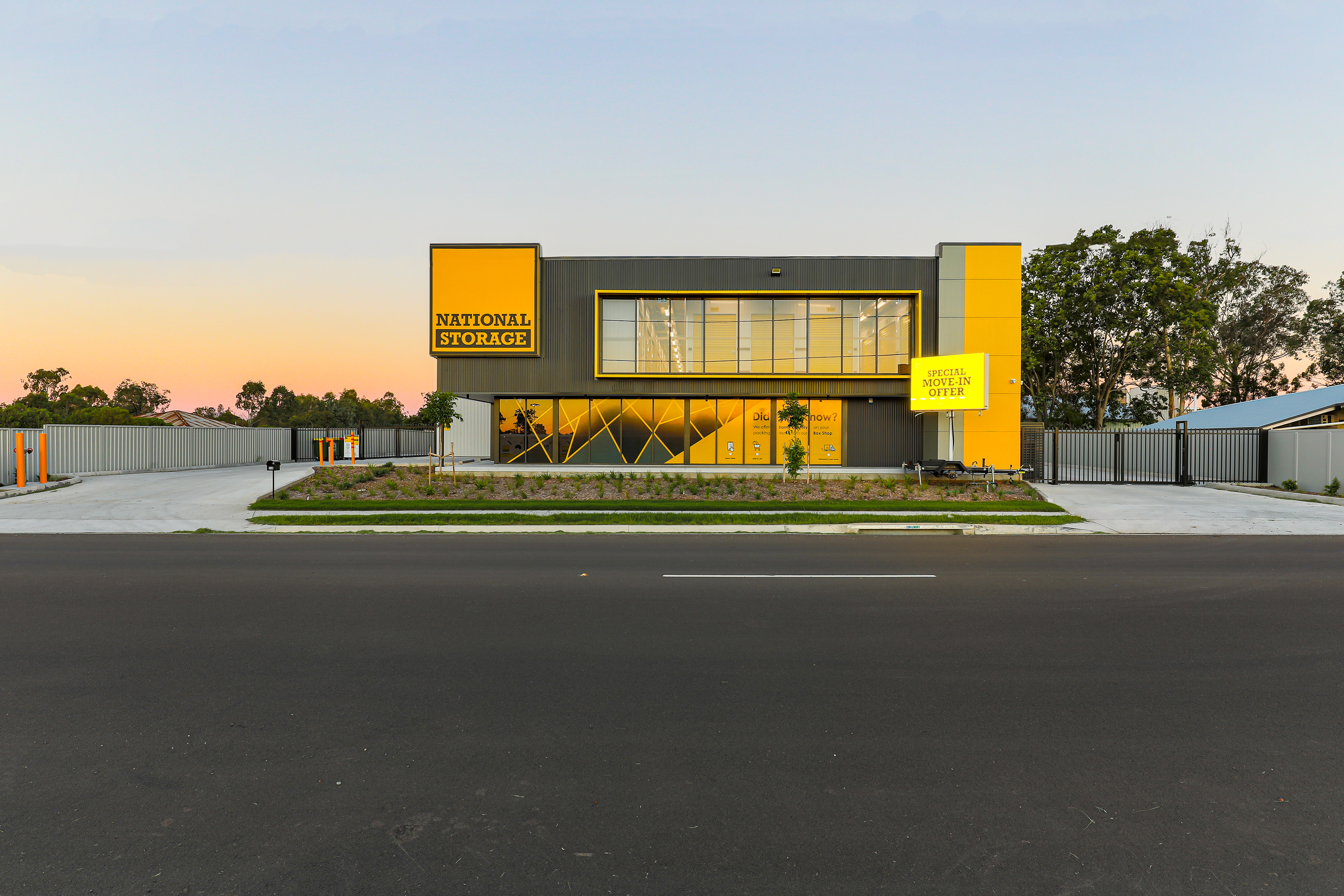 National Storage facility with bold yellow and black exterior, showcasing 24-hour access and secure storage solutions, located in Brisbane, QLD. Professional commercial photography by Jeremy Murphy.