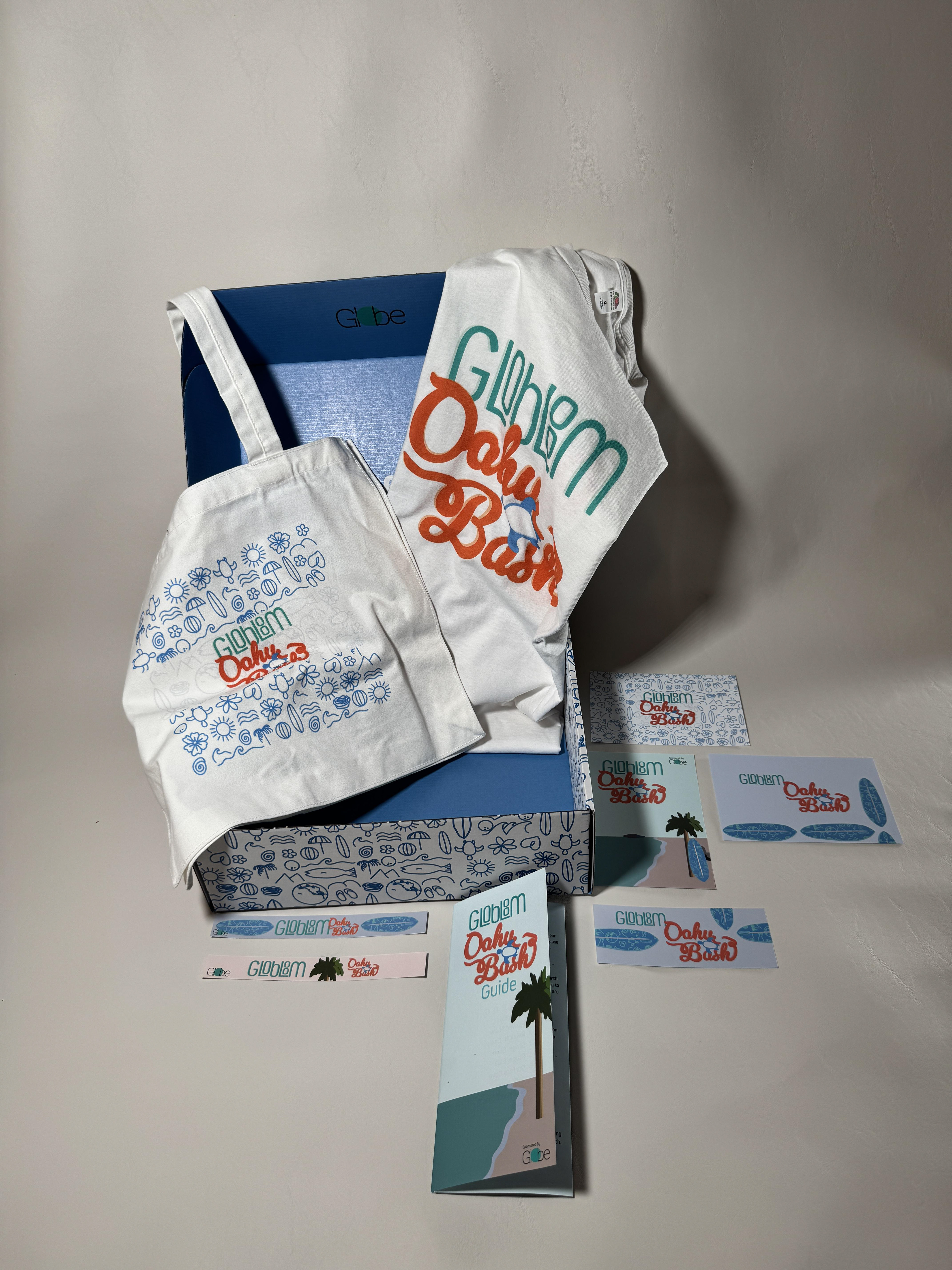 tote bag, t-shirt, postcards, brochure, tickets, waistbands and box