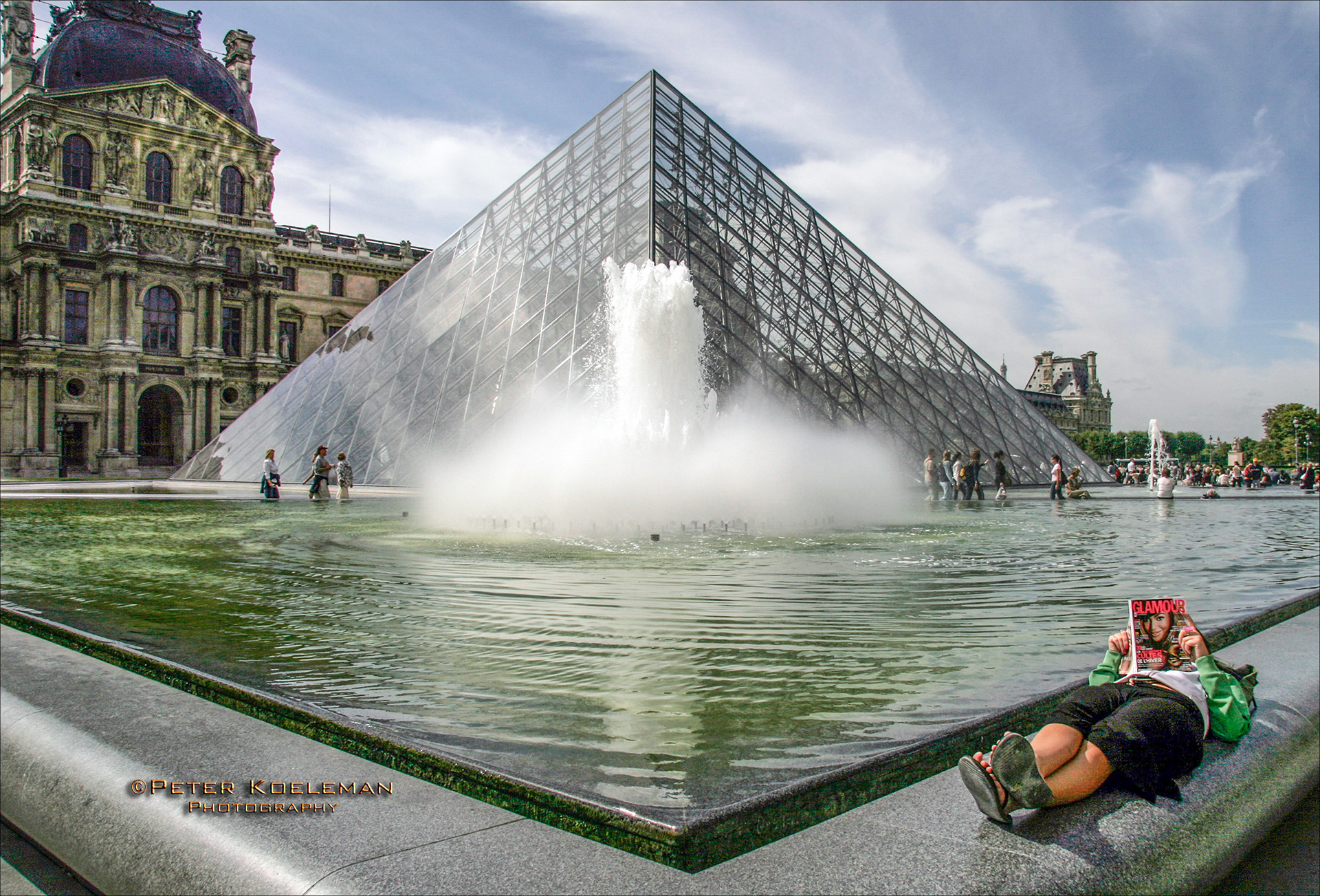 Taking a Break by the Louvre Glass Pyramid - Paris