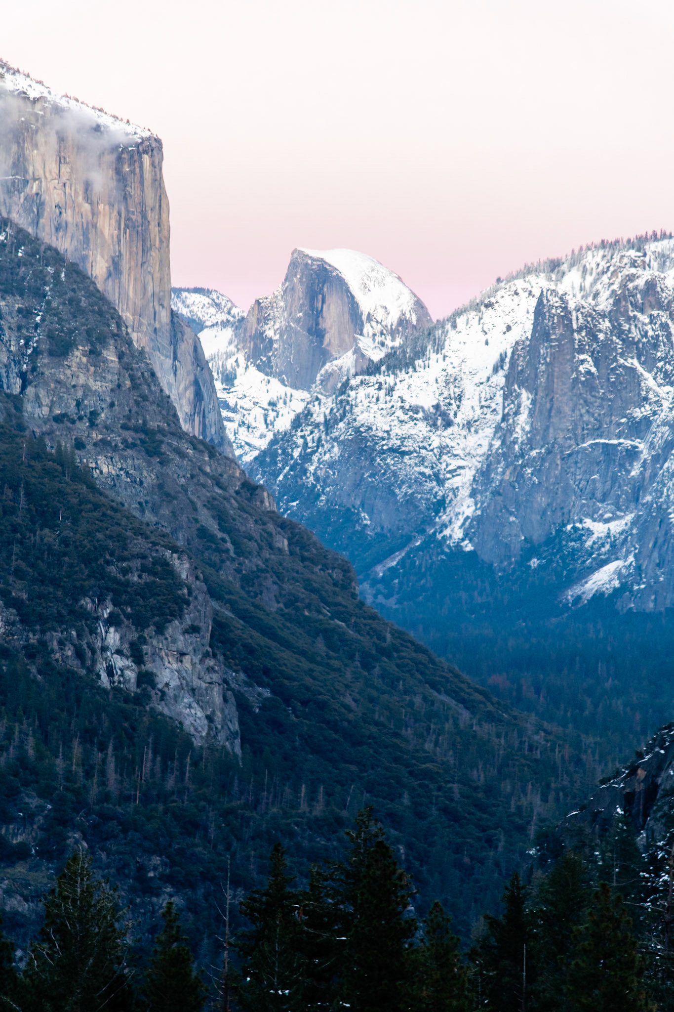Awesome sunset photo of Half Dome. Got some crazy colors because of the clouds and snow.