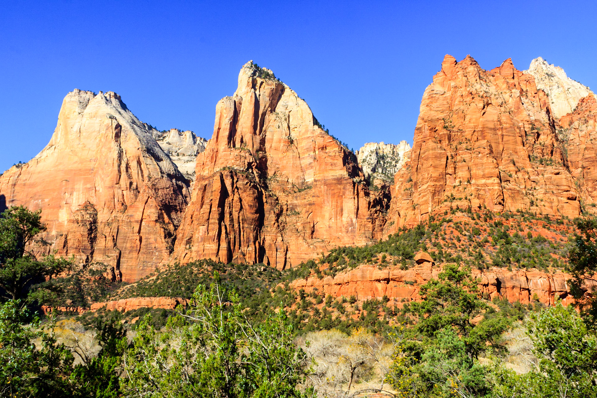 The Court of the Patriarchs with Abraham Peak (left), Issac Peak (center), Mount Moroni (right, red), and Jacob Peak (right, grey). They were named by a local Methodist Minister.
