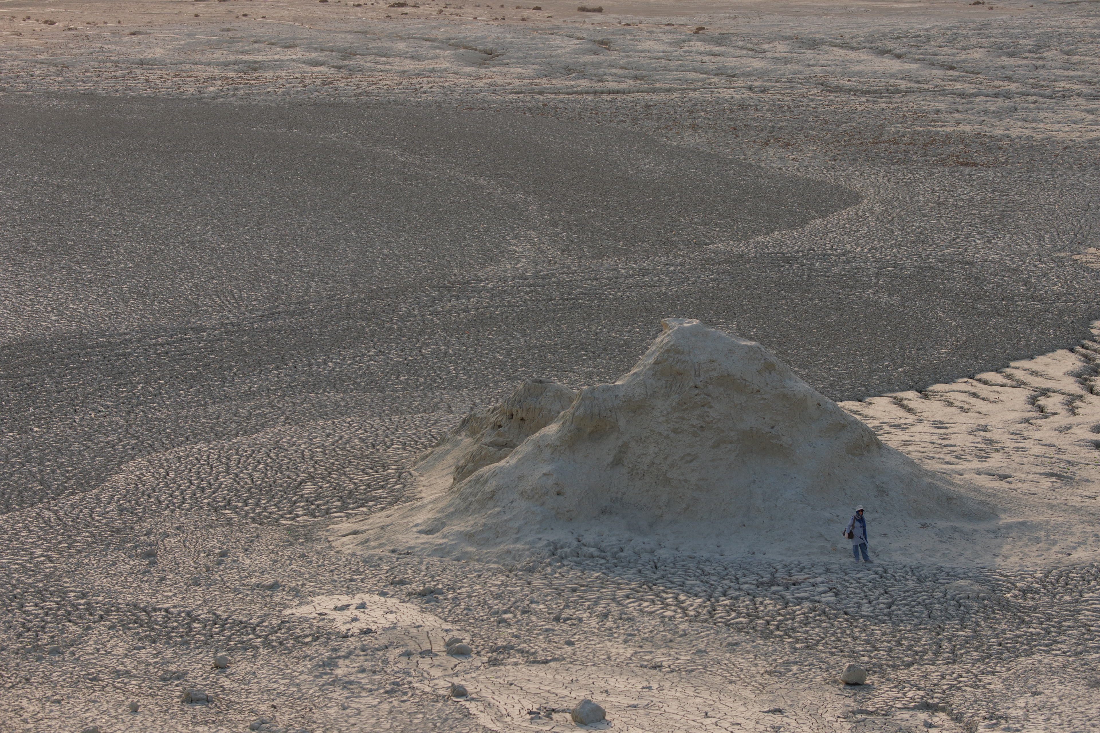 on top of a mud volcano looking at my mom