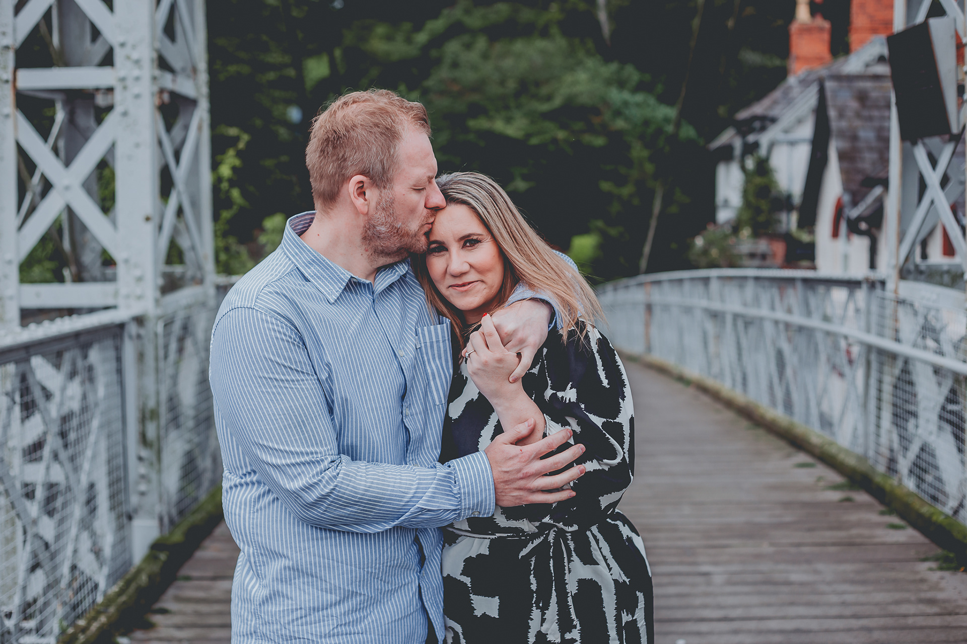 Engaged couple engagement ring on bridge in Chester
