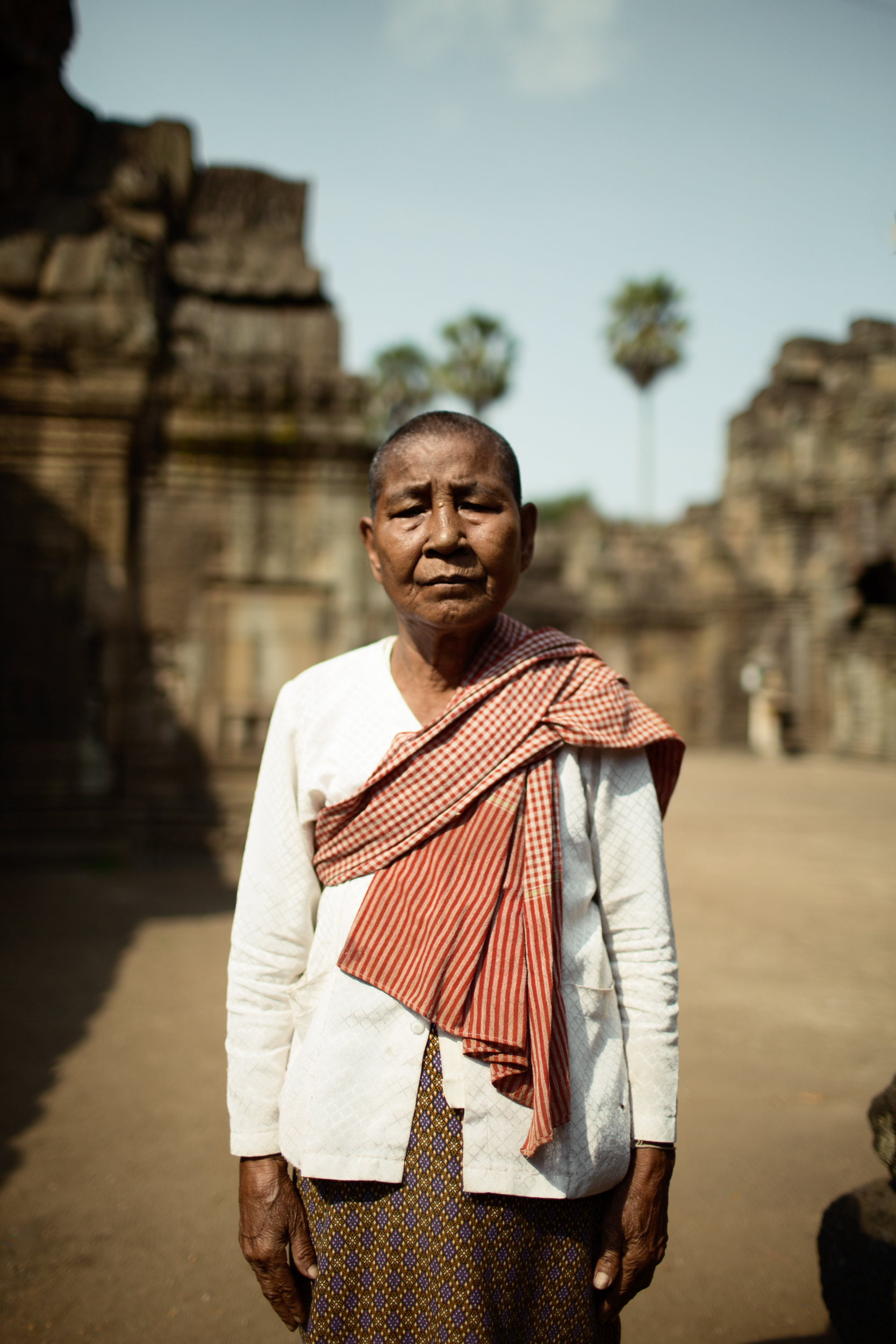 Portrait of a Cambodian guardian woman standing at the Vat Nokor