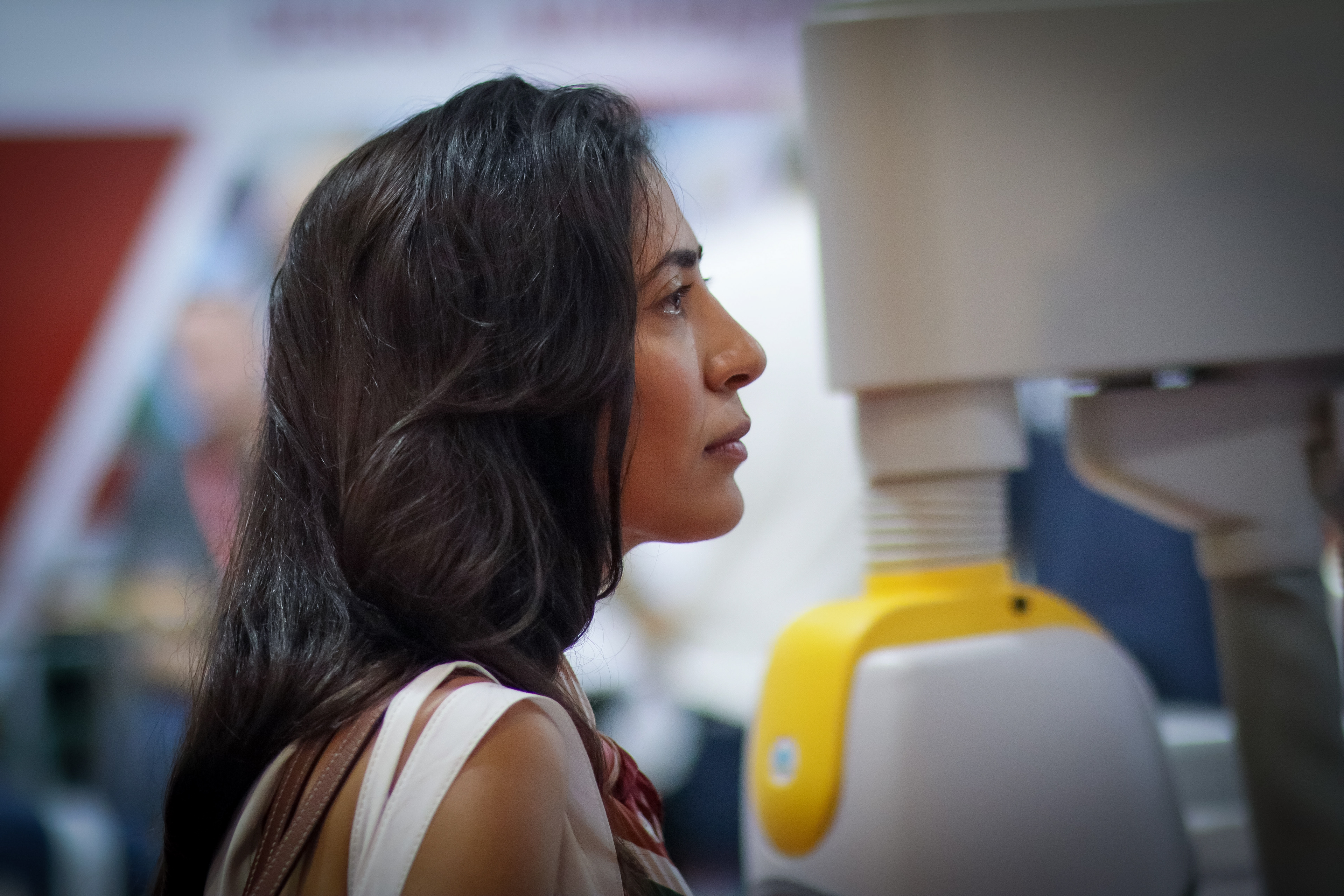 Reportage-style profile portrait shot with shallow depth of field at a trade show
