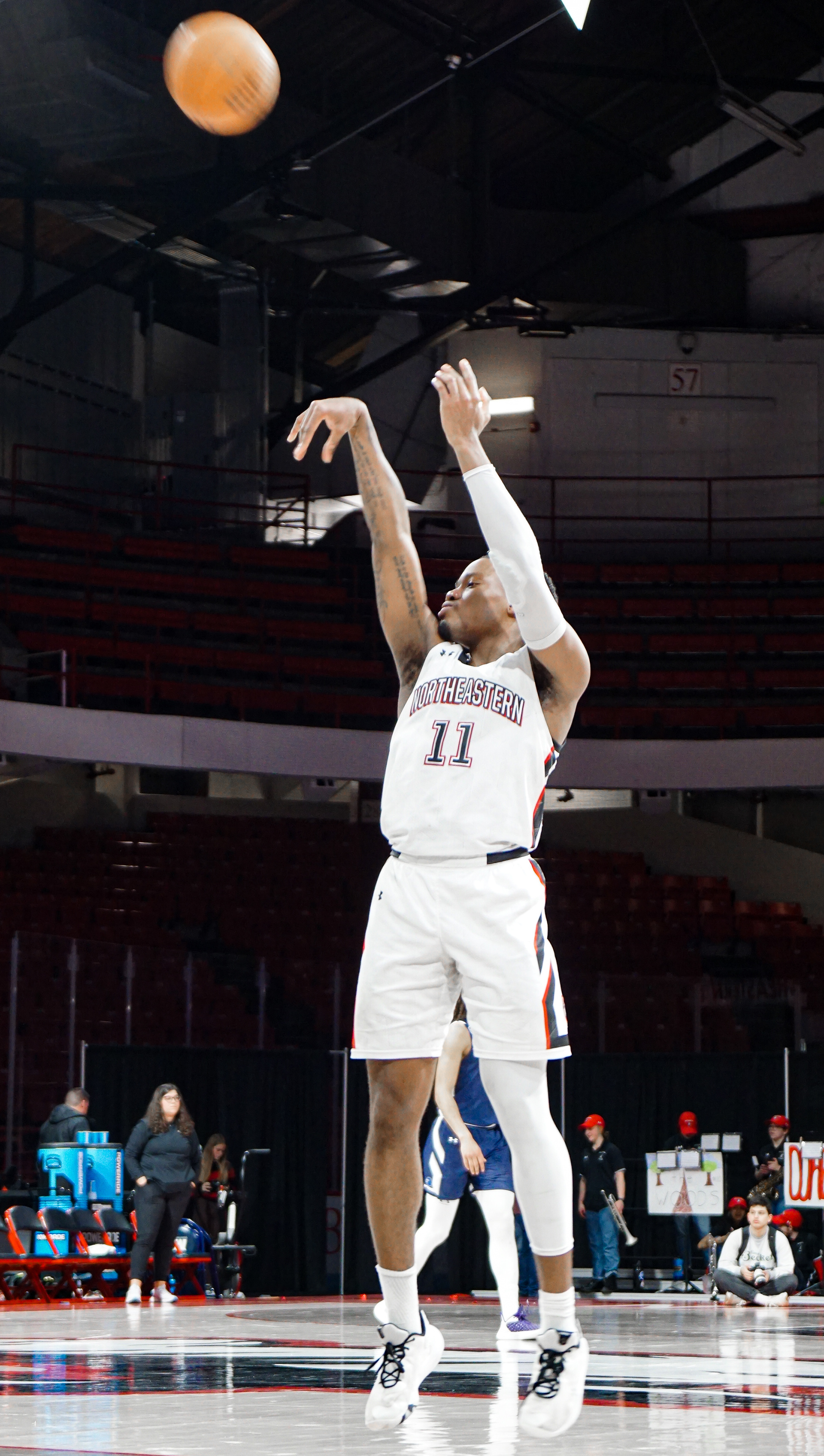 #11 Jahmyl Telfort takes a shot from the 3-point line.