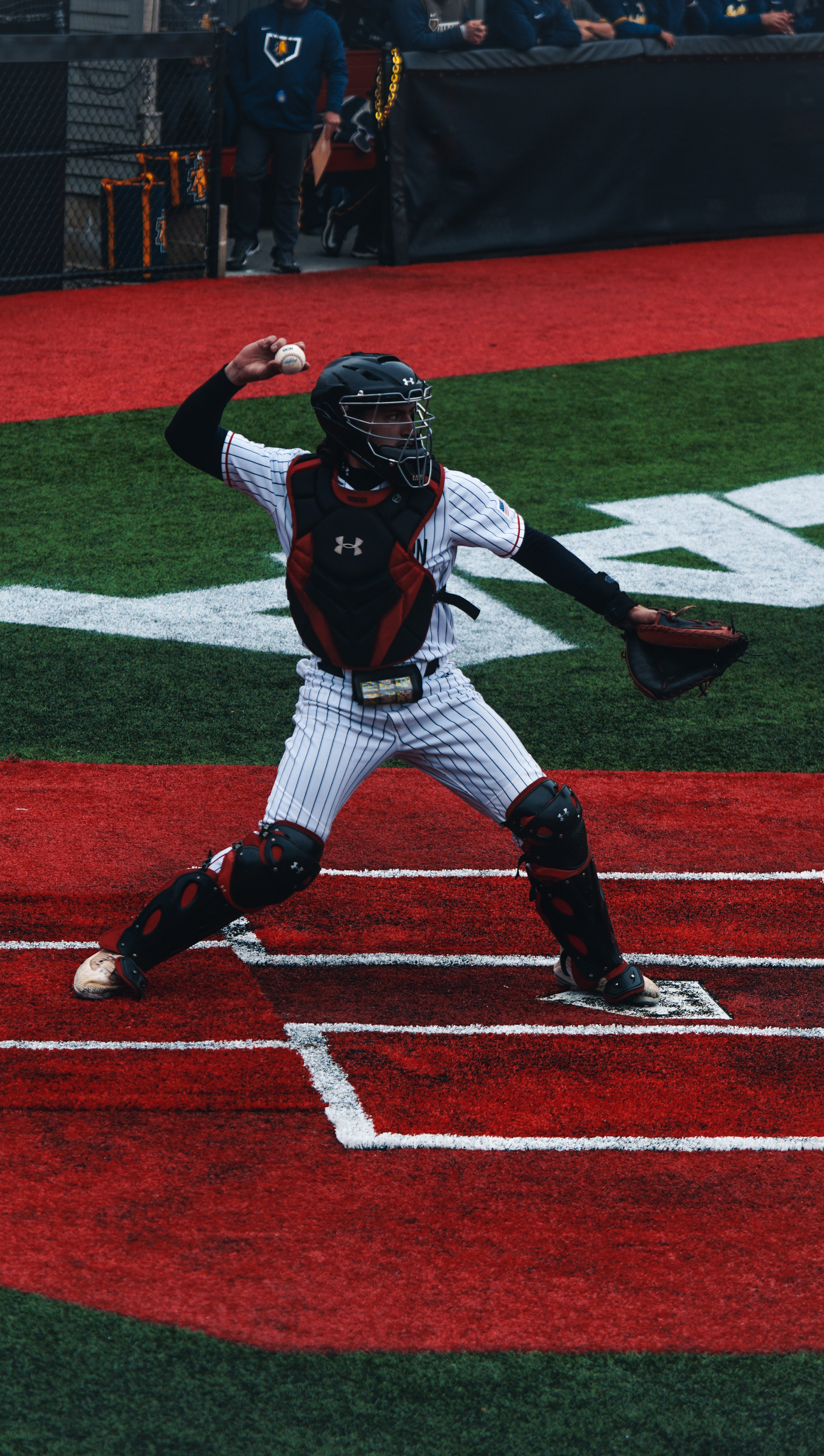 #49 Gregory Bozzo throws to pitcher.