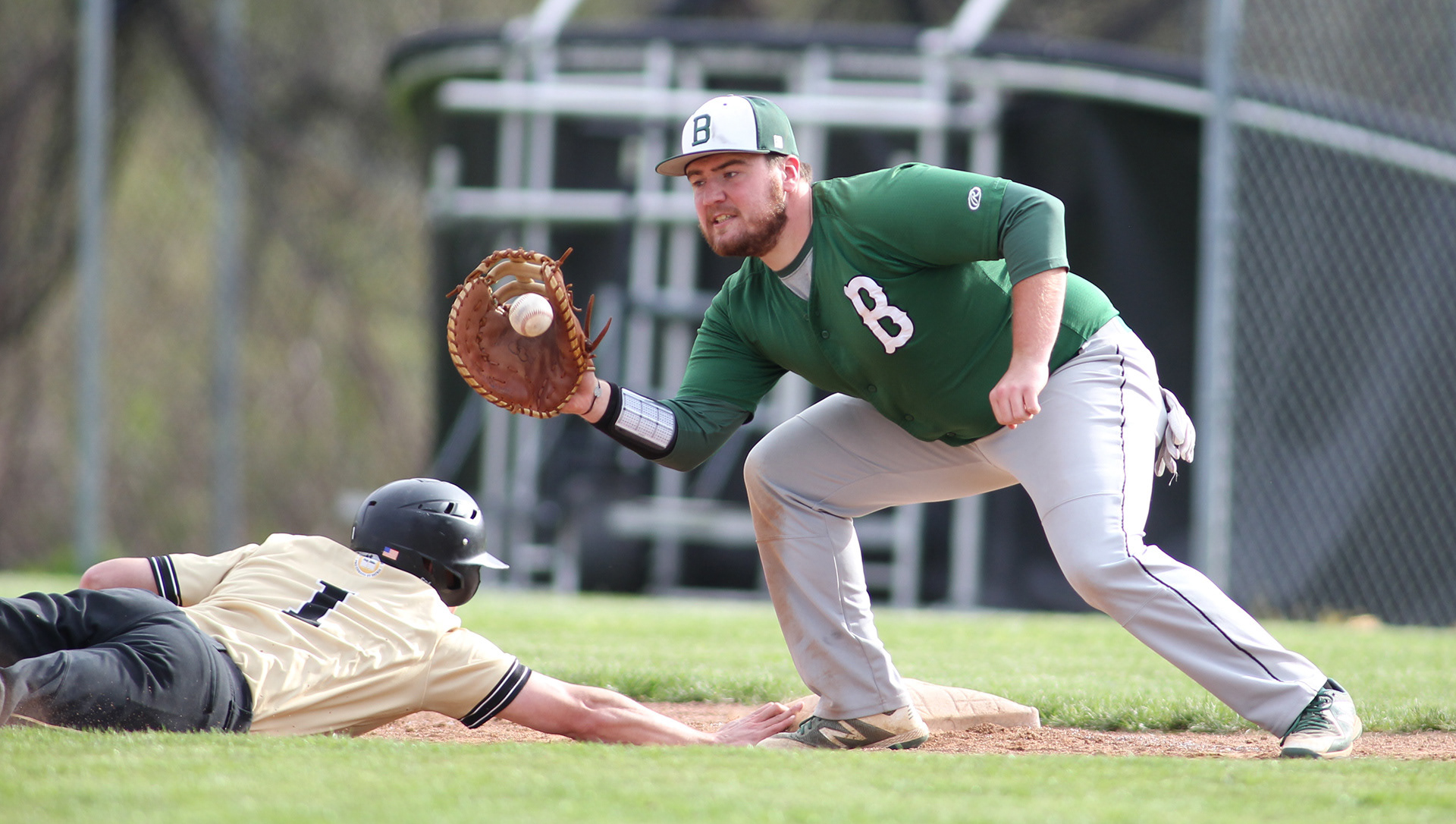Bethany’s Jake Stemmerich attempts to pick off Geneva’s Mark Overmier after receiving a throw from Pitcher Nick Gross. (Michael Longo/Bethany Athletics)