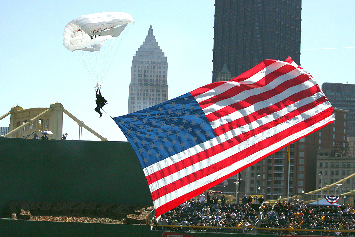 During the 2014 Pittsburgh Pirates Home Opener a Paratrooper approaches his landing on the outfield of PNC Park in Pittsburgh PA. (Michael Longo/Ai Wire)