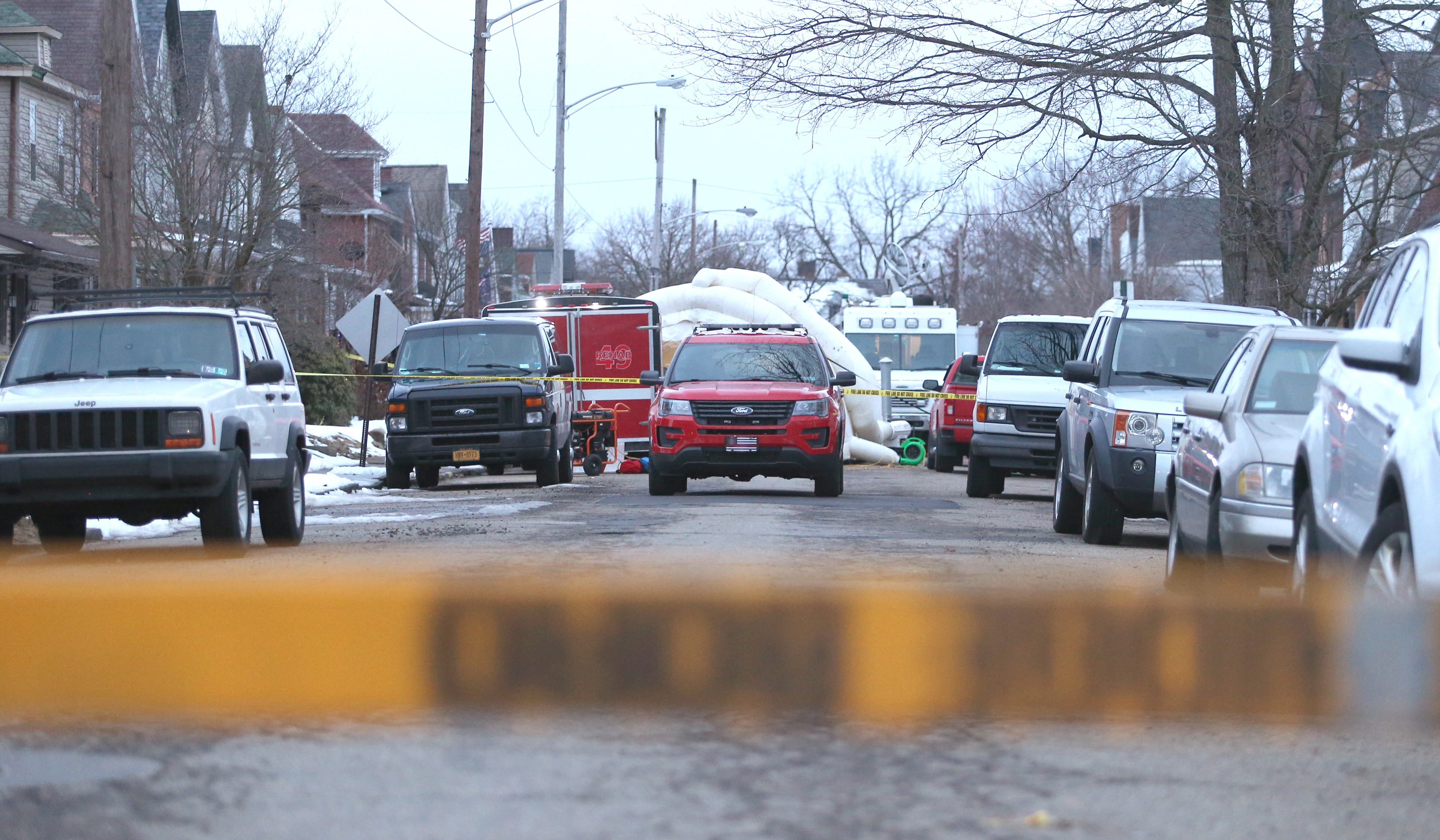 An Ambridge Fire Department Squad car is seen blocking the street as a second barrier at the 900 block of Maplewood Avenue after tragedy struck in Ambridge, Pennsylvania on February 22, 2021. (Photo By: Michael Longo/For BCT)